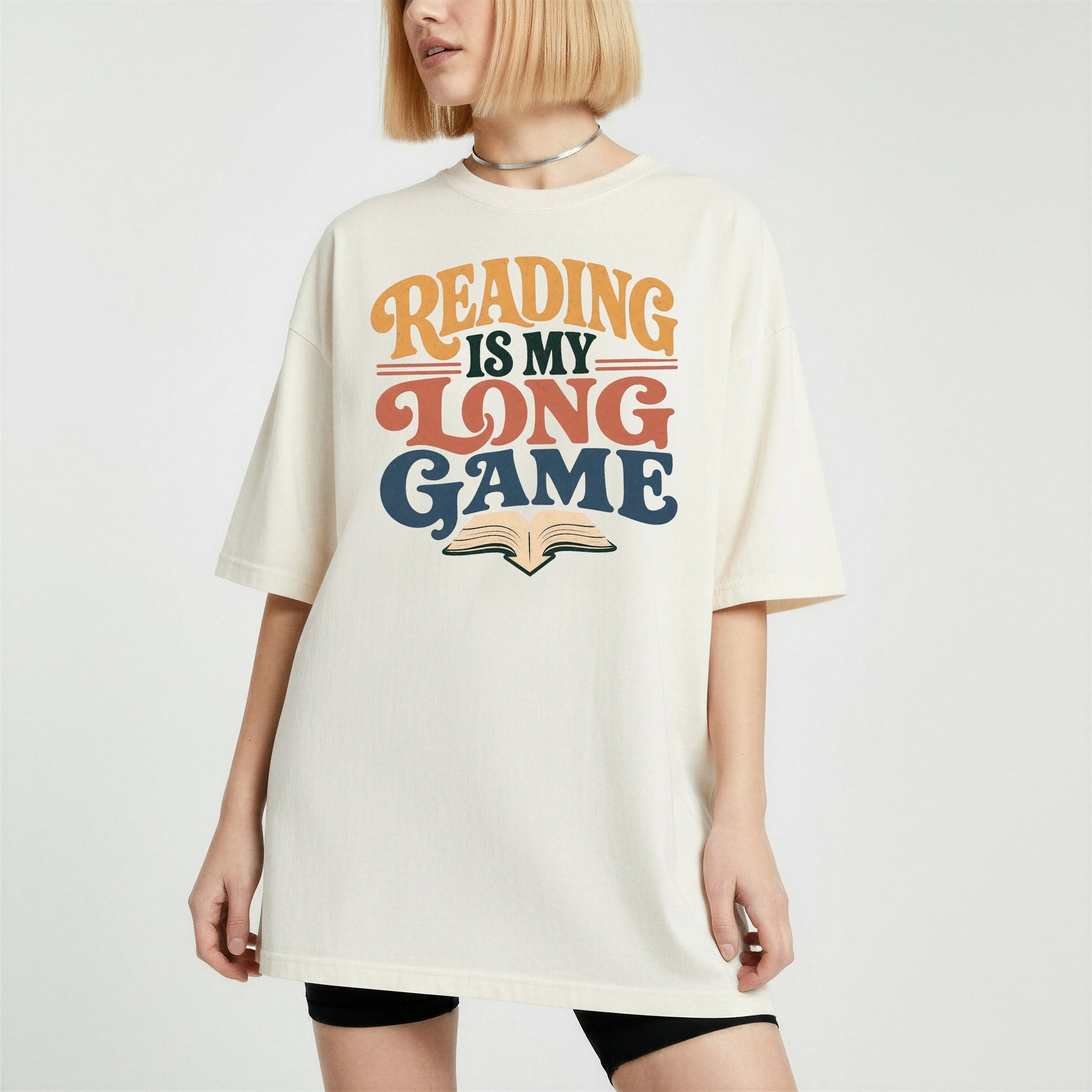 Reading Is My Long Game bookish tee in Ivory, worn