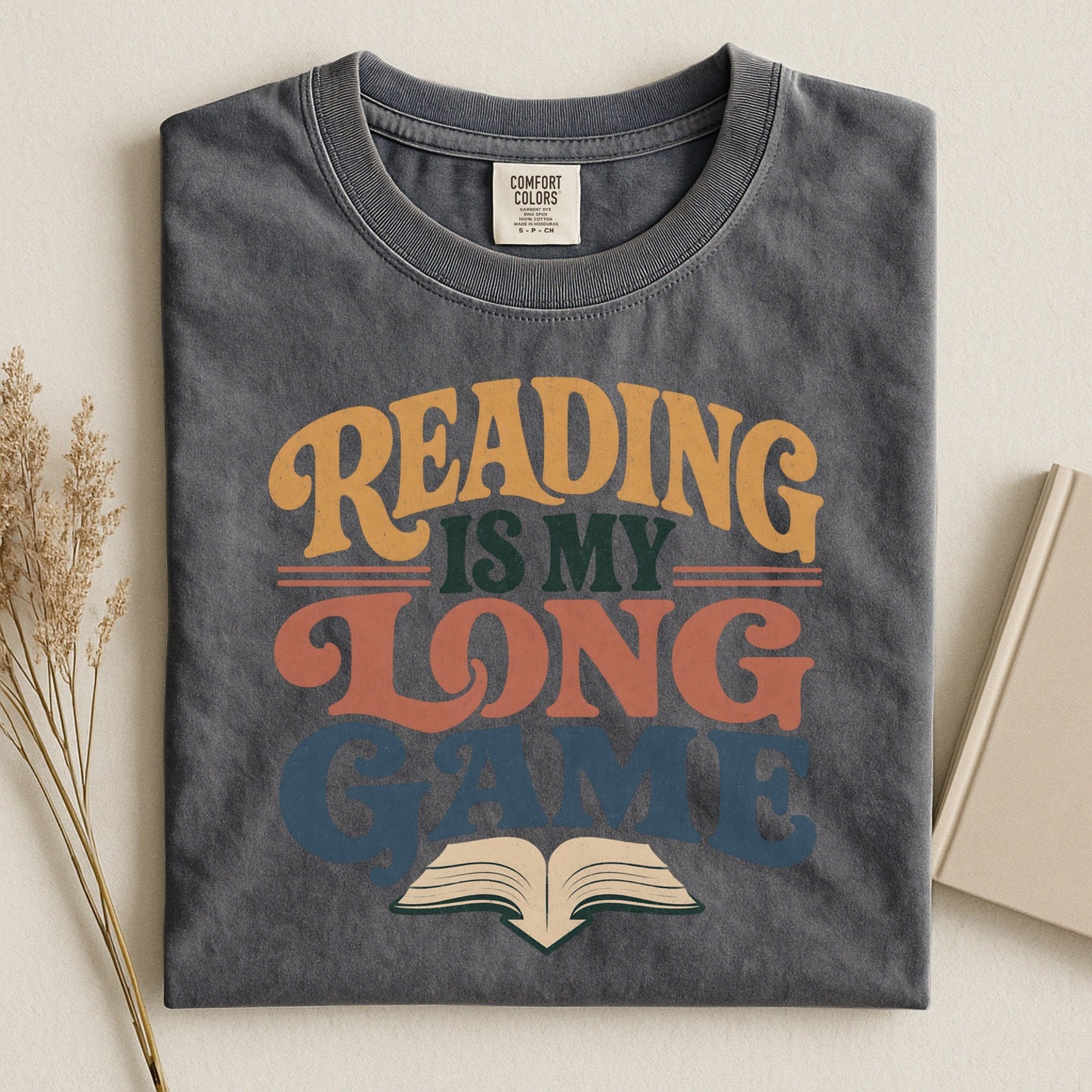 Reading Is My Long Game bookish tee in Pepper, flat lay
