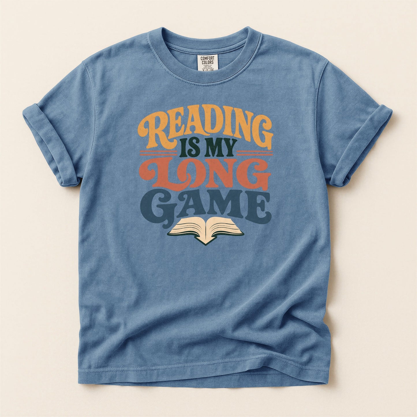 Reading Is My Long Game bookish tee in Blue Jean, full flat