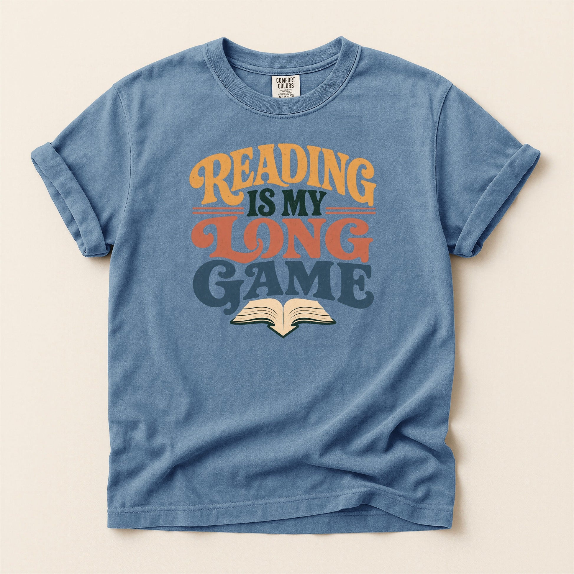 Reading Is My Long Game bookish tee in Blue Jean, full flat