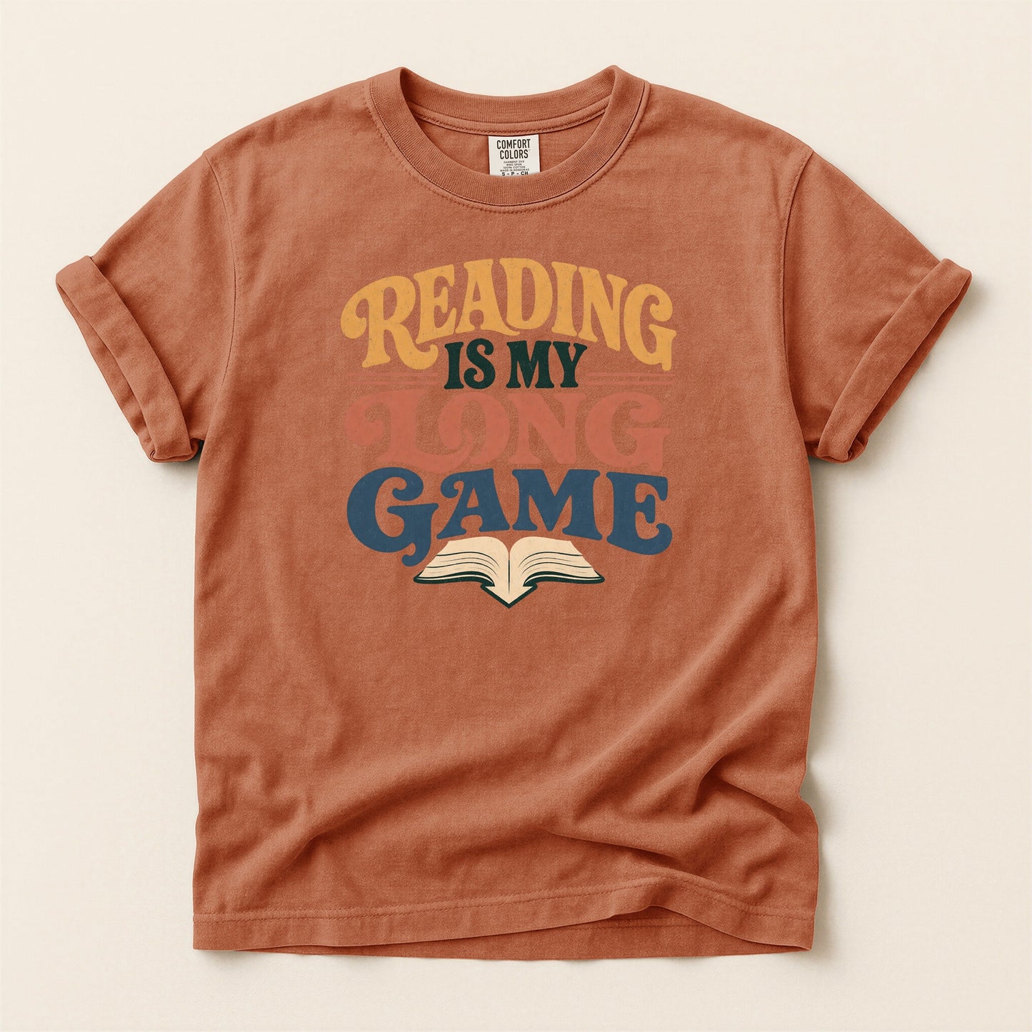 Reading Is My Long Game bookish tee in Yam, full flat