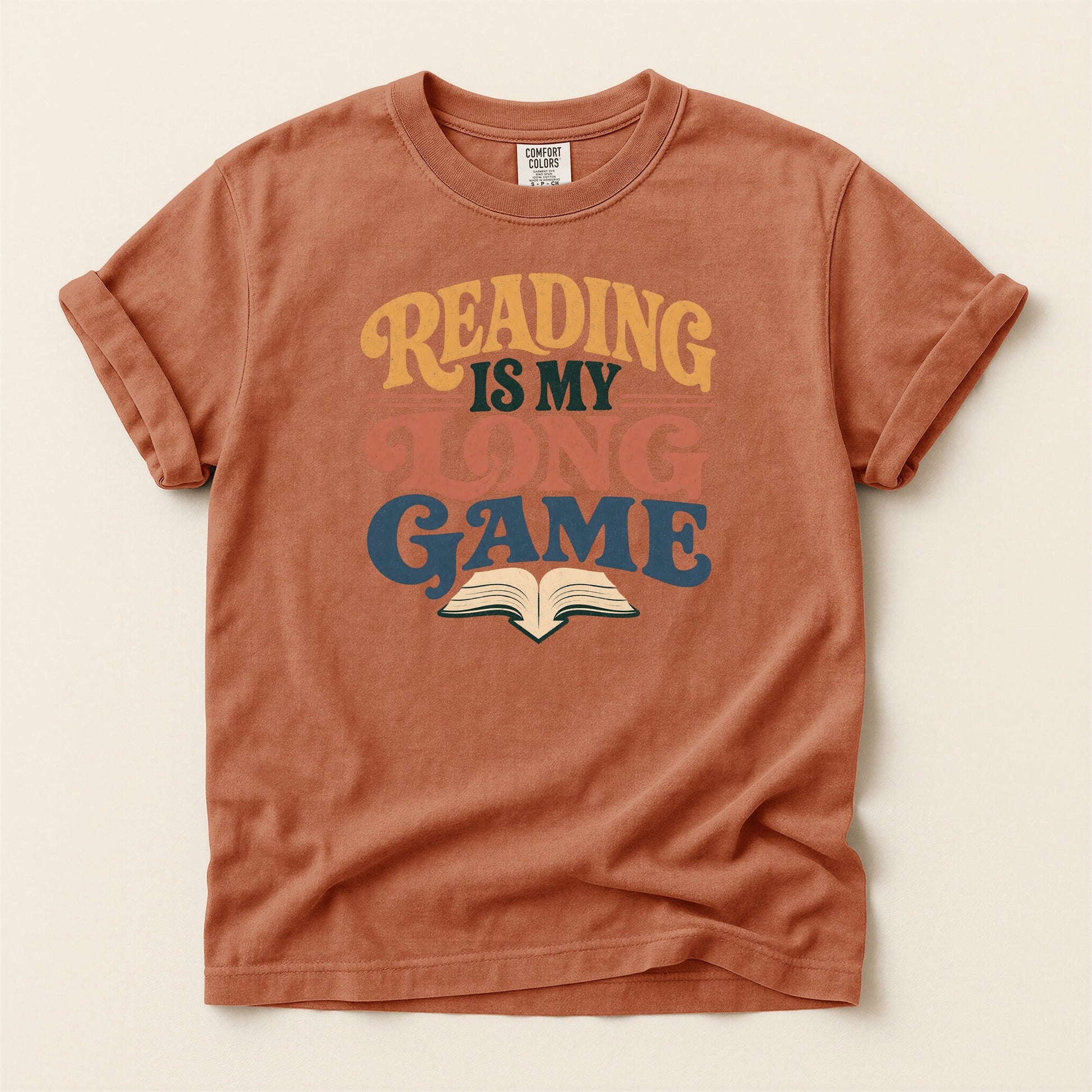 Reading Is My Long Game bookish tee in Yam, full flat