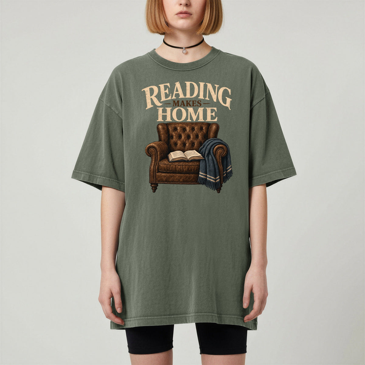 Shelf Love Studio Reading Makes Home t-shirt in Moss, worn