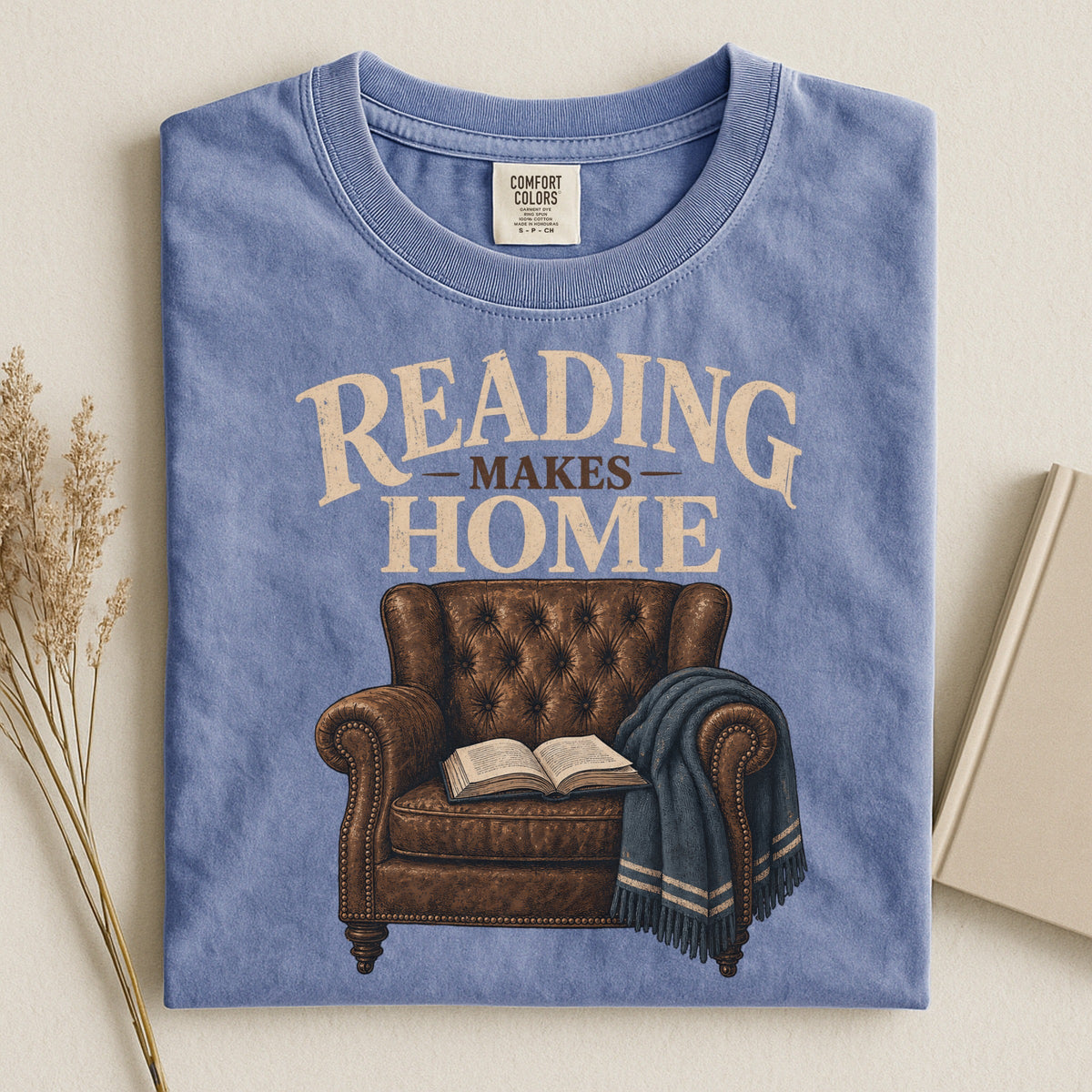 Shelf Love Studio Reading Makes Home t-shirt in Blue Jean, styled flat lay