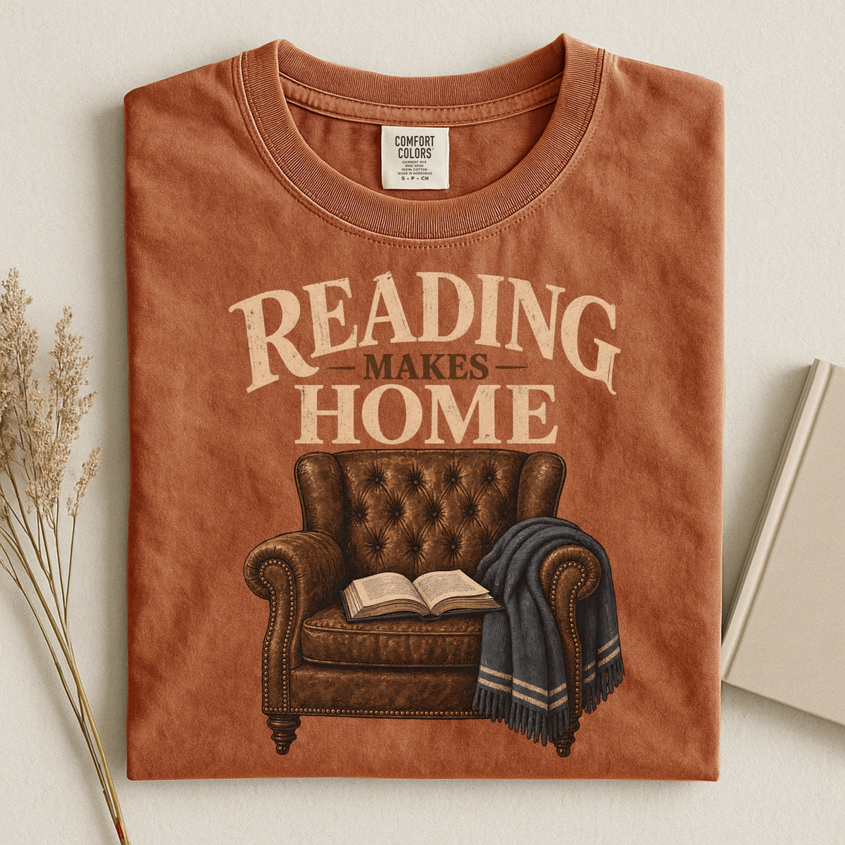 Shelf Love Studio Reading Makes Home t-shirt in Yam, styled flat lay