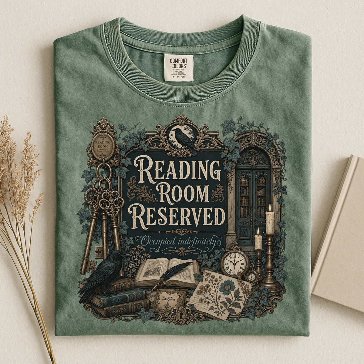 Reading Room Reserved bookish tee in Moss, flat lay