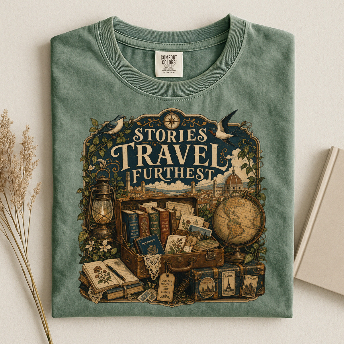 Stories Travel Furthest bookish tee in Moss, flat lay