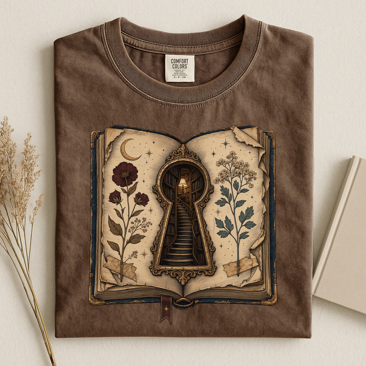 Shelf Love Studio Surreal Keyhole Book t-shirt in Espresso, styled flat lay