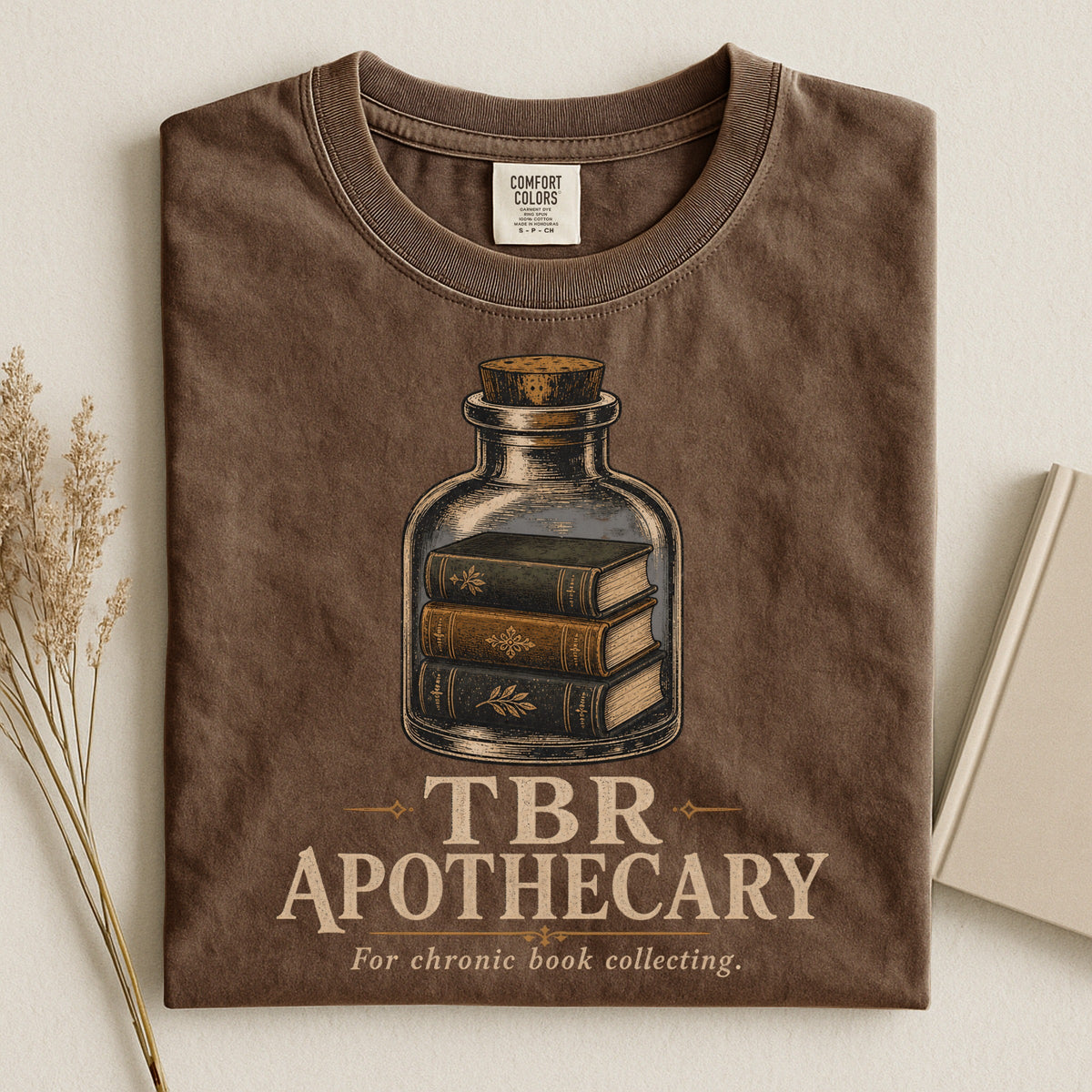 Shelf Love Studio TBR Apothecary t-shirt in Espresso, styled flat lay