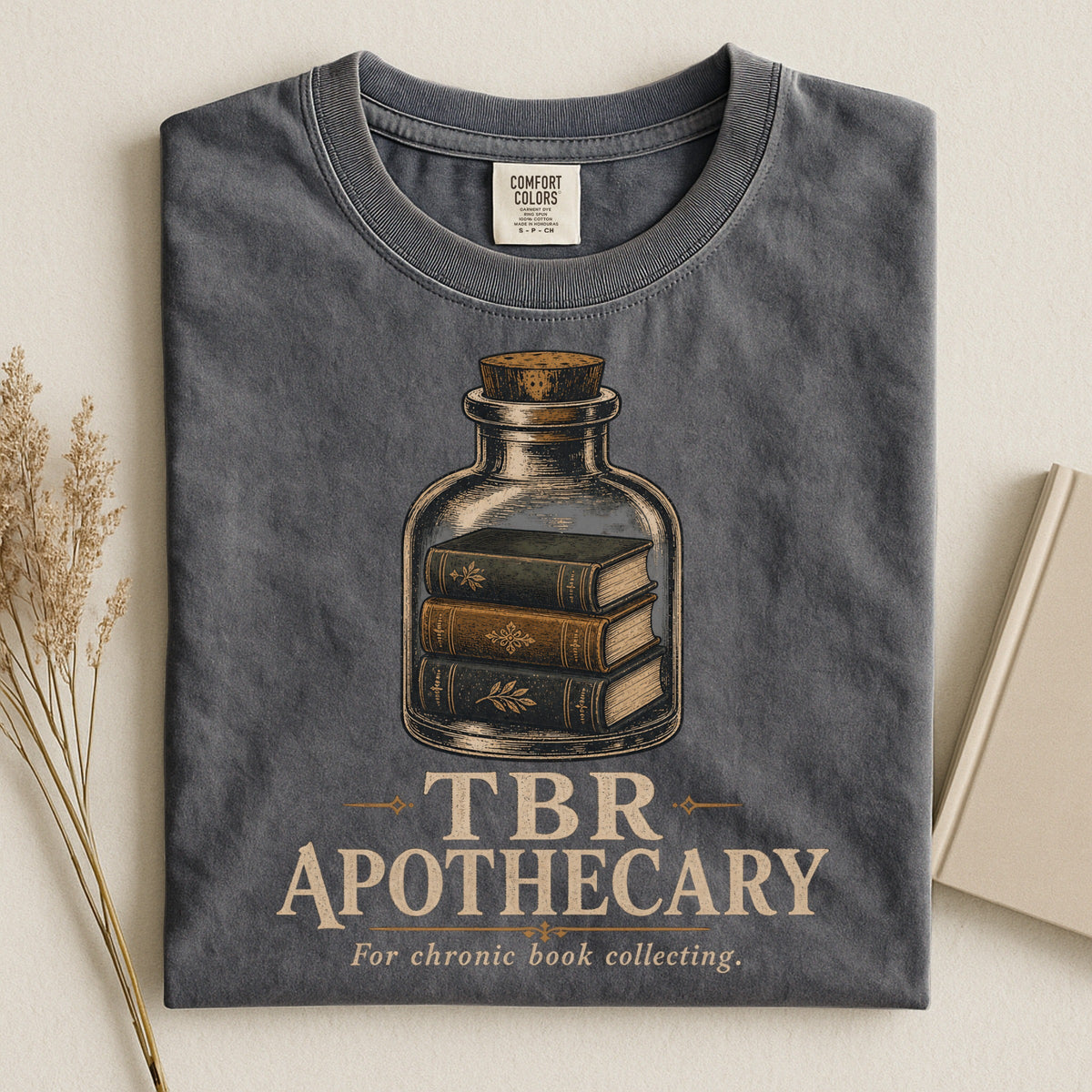 Shelf Love Studio TBR Apothecary t-shirt in Pepper, styled flat lay