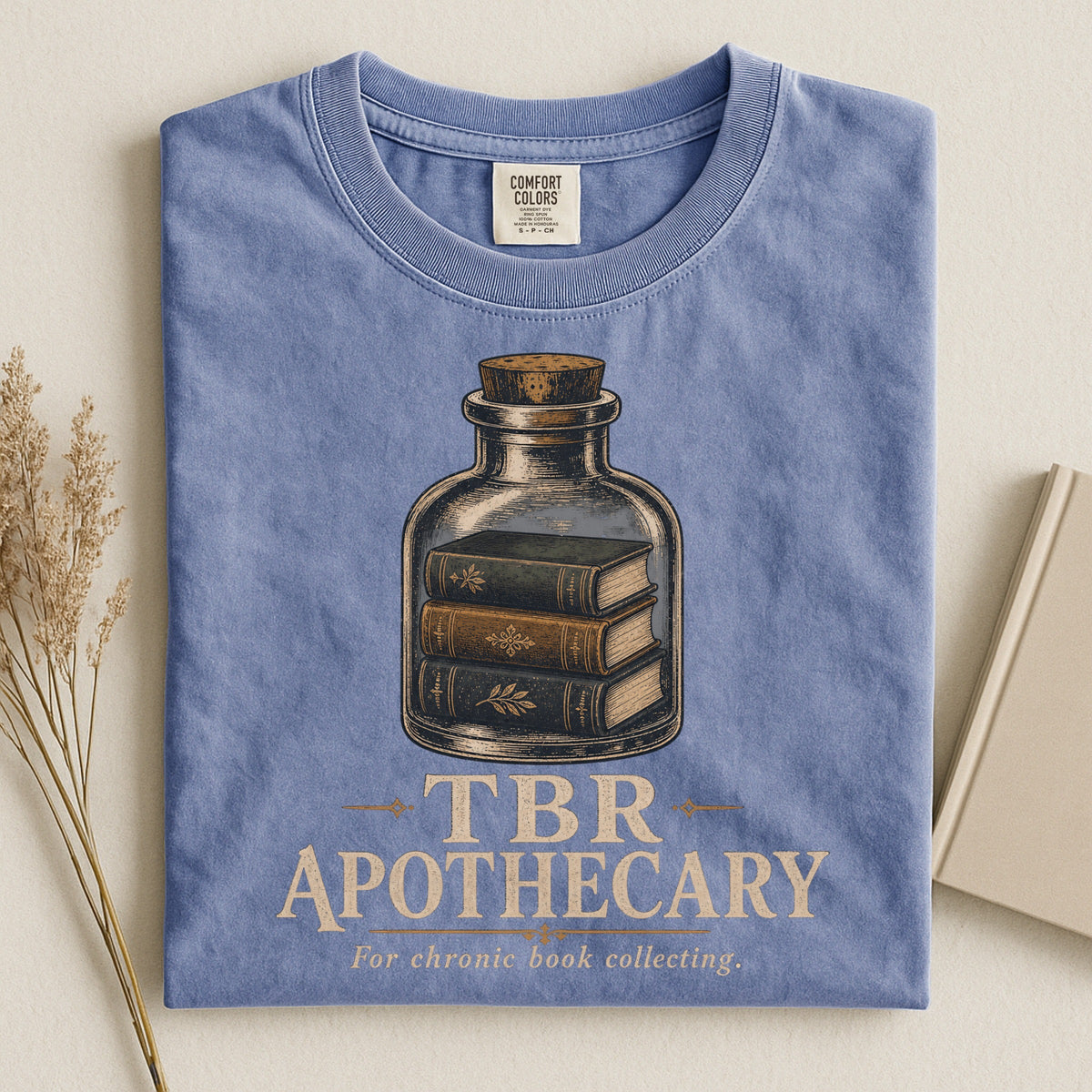 Shelf Love Studio TBR Apothecary t-shirt in Blue Jean, styled flat lay