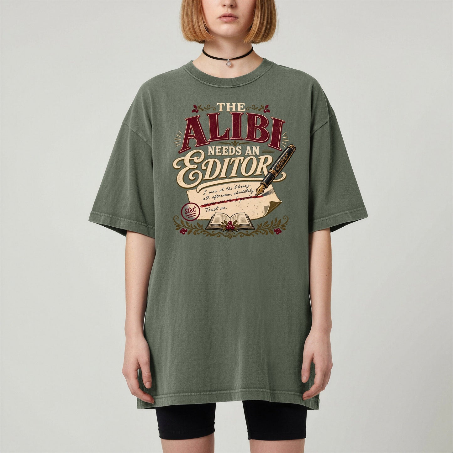 The Alibi Needs an Editor bookish tee in Moss, worn