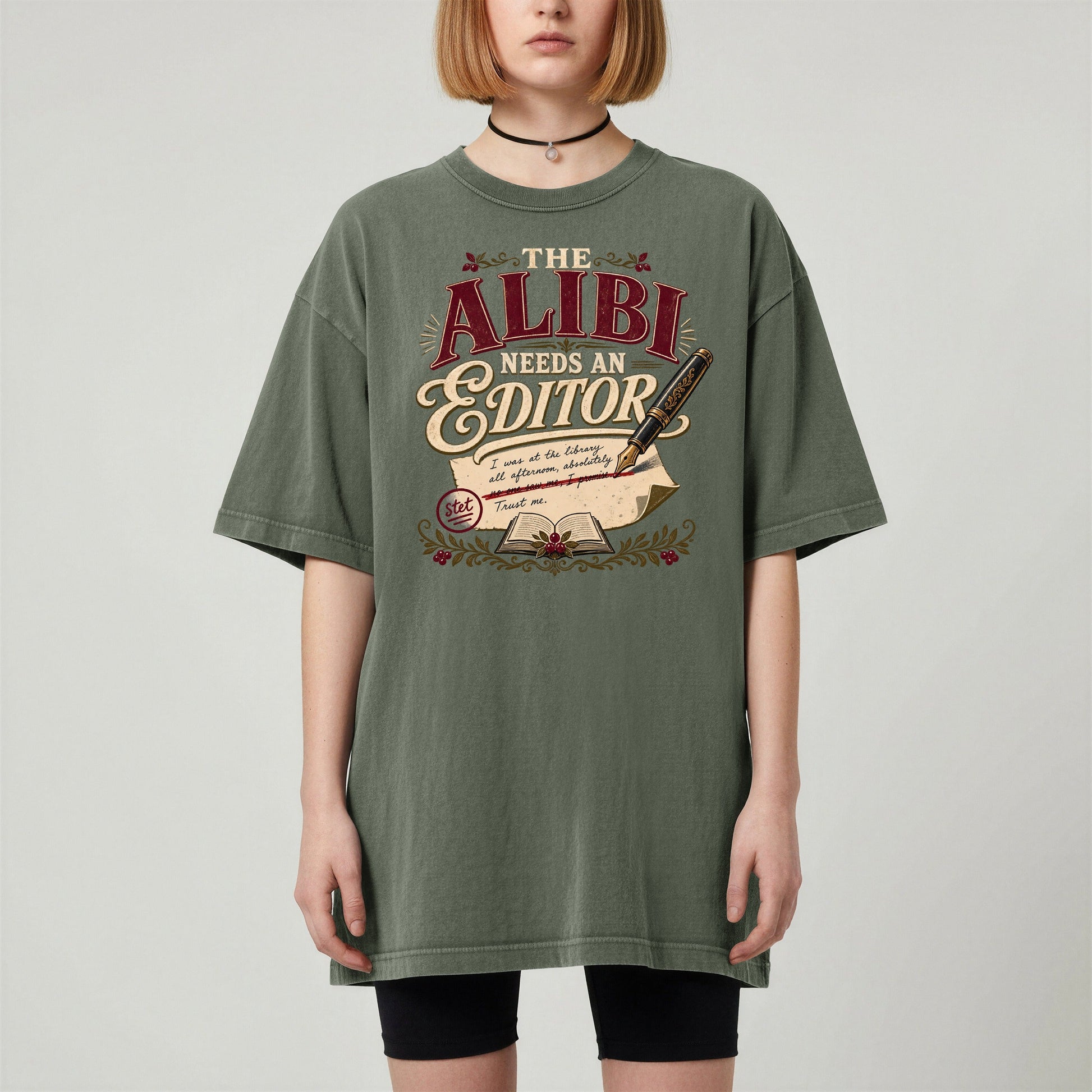 The Alibi Needs an Editor bookish tee in Moss, worn