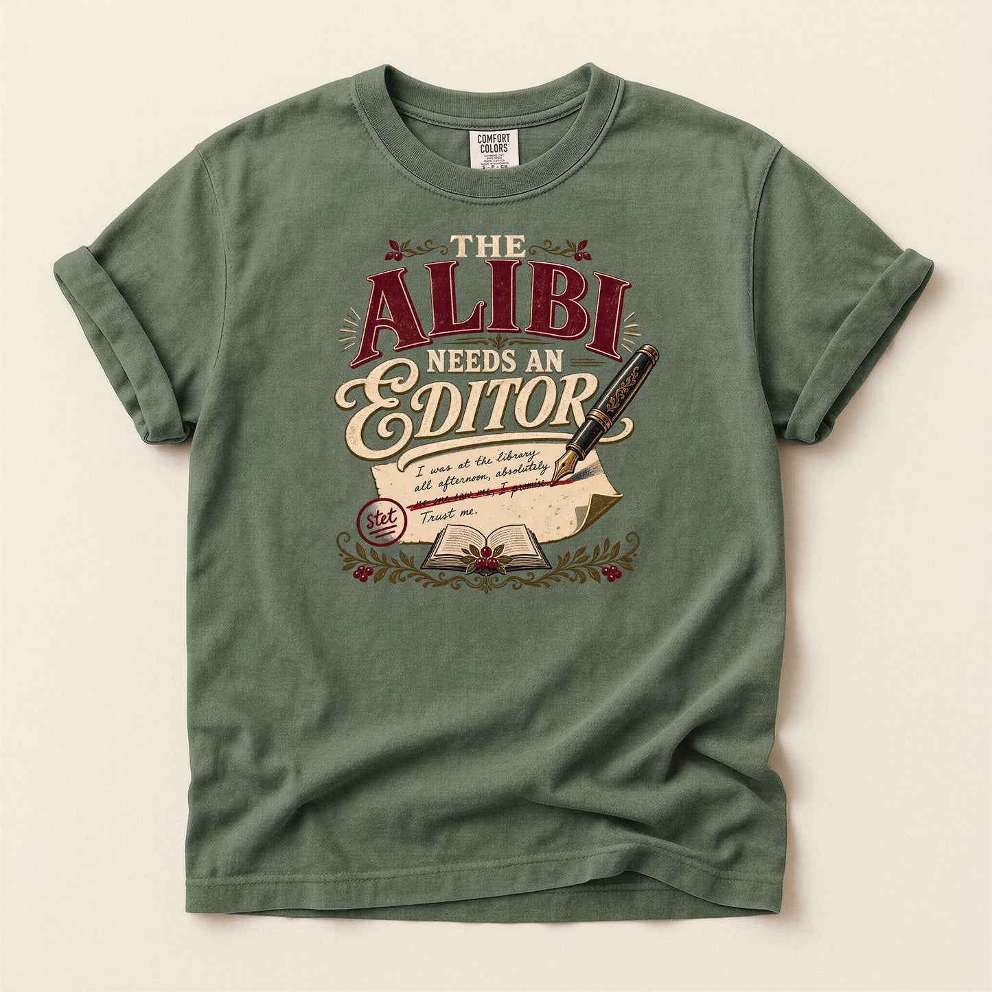 The Alibi Needs an Editor bookish tee in Moss, full flat