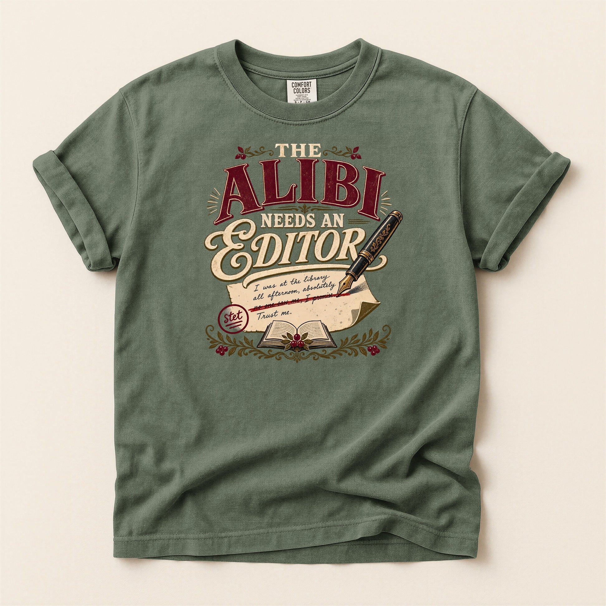The Alibi Needs an Editor bookish tee in Moss, full flat