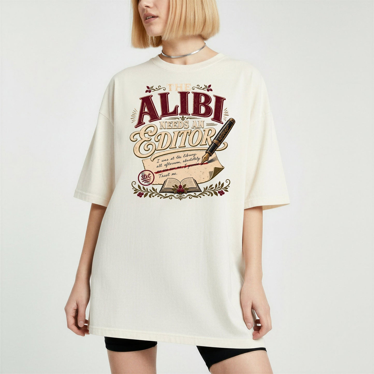 The Alibi Needs an Editor bookish tee in Ivory, worn
