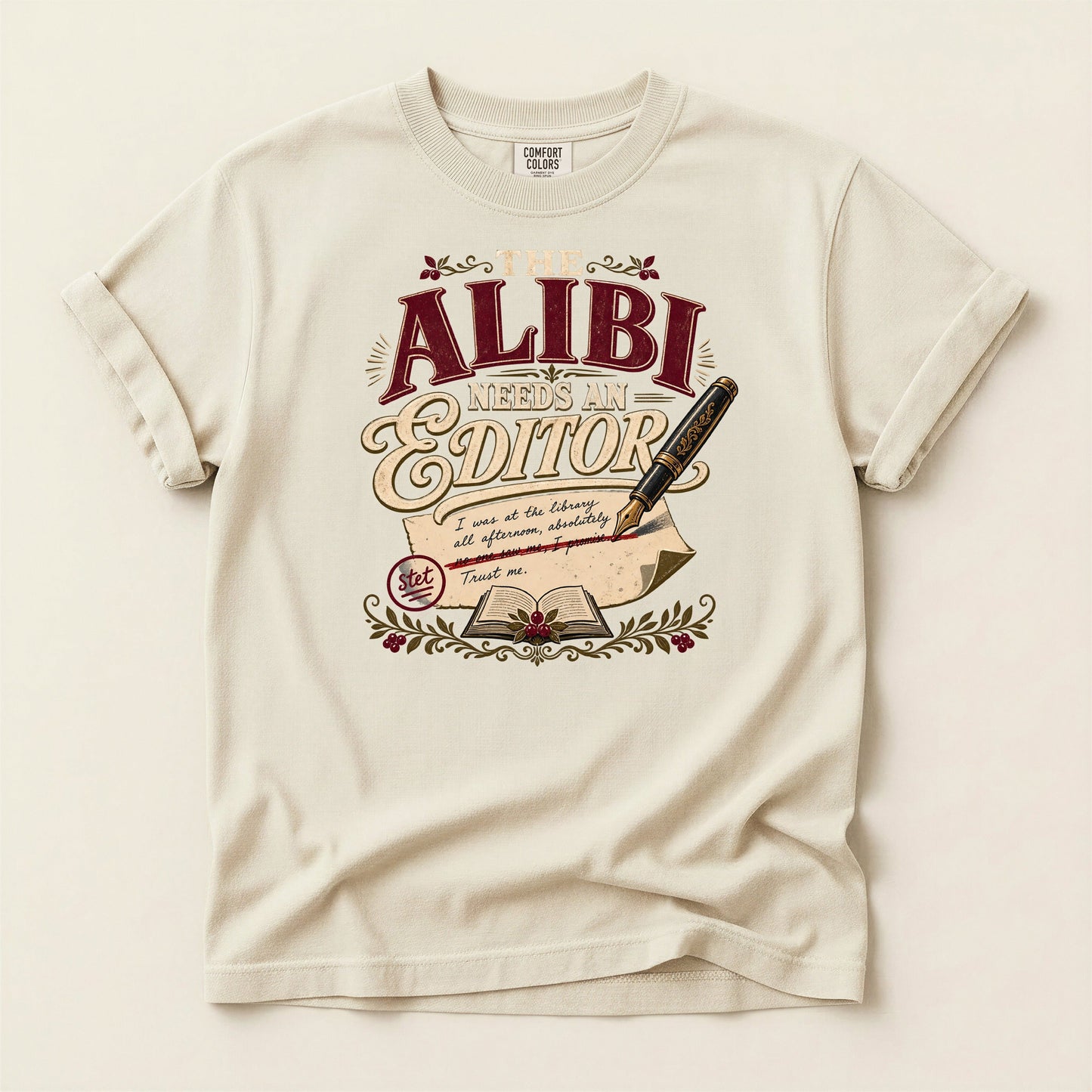 The Alibi Needs an Editor bookish tee in Ivory, full flat