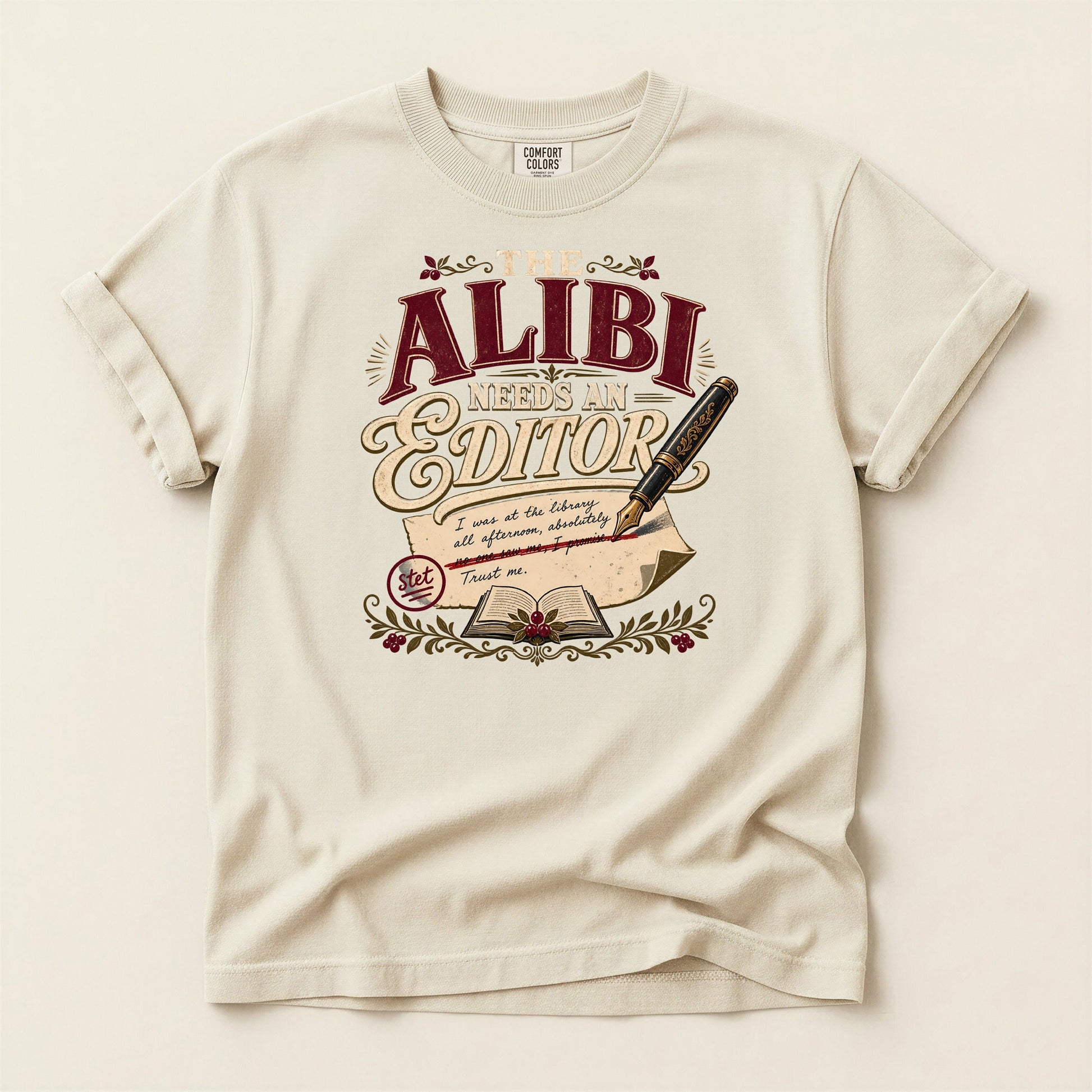 The Alibi Needs an Editor bookish tee in Ivory, full flat