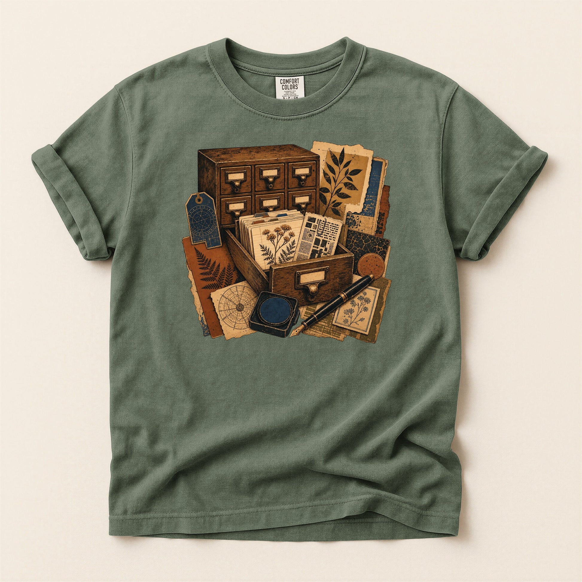 The Card Catalog bookish tee in Moss, full flat