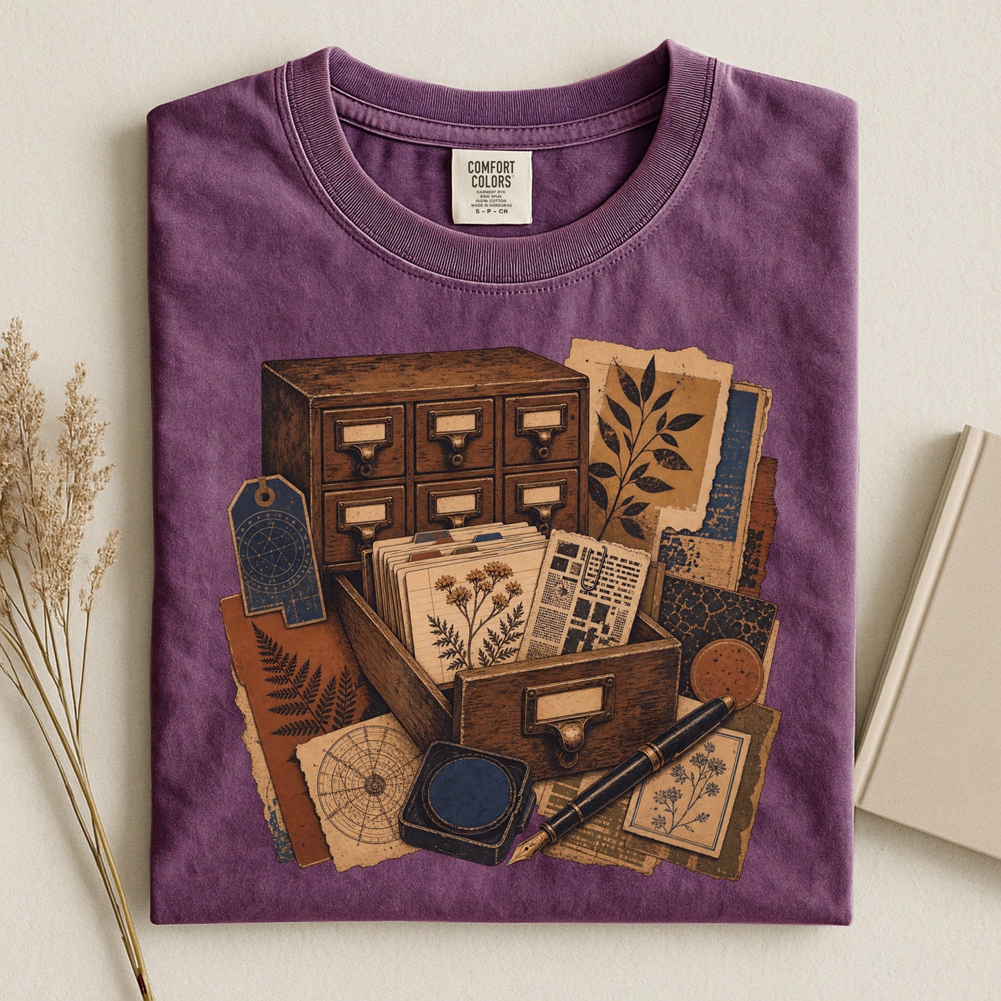 The Card Catalog bookish tee in Berry, flat lay