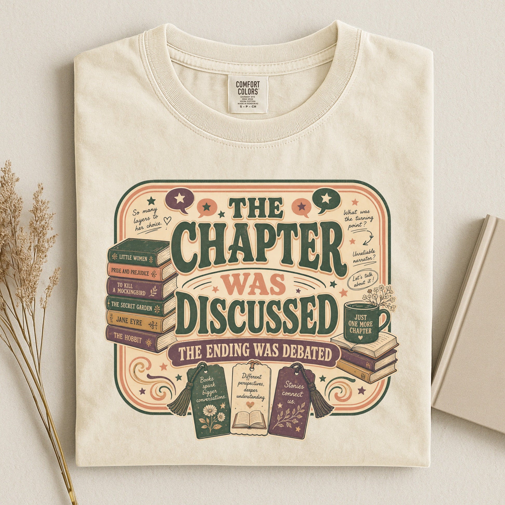 The Chapter Was Discussed bookish tee in Ivory, flat lay