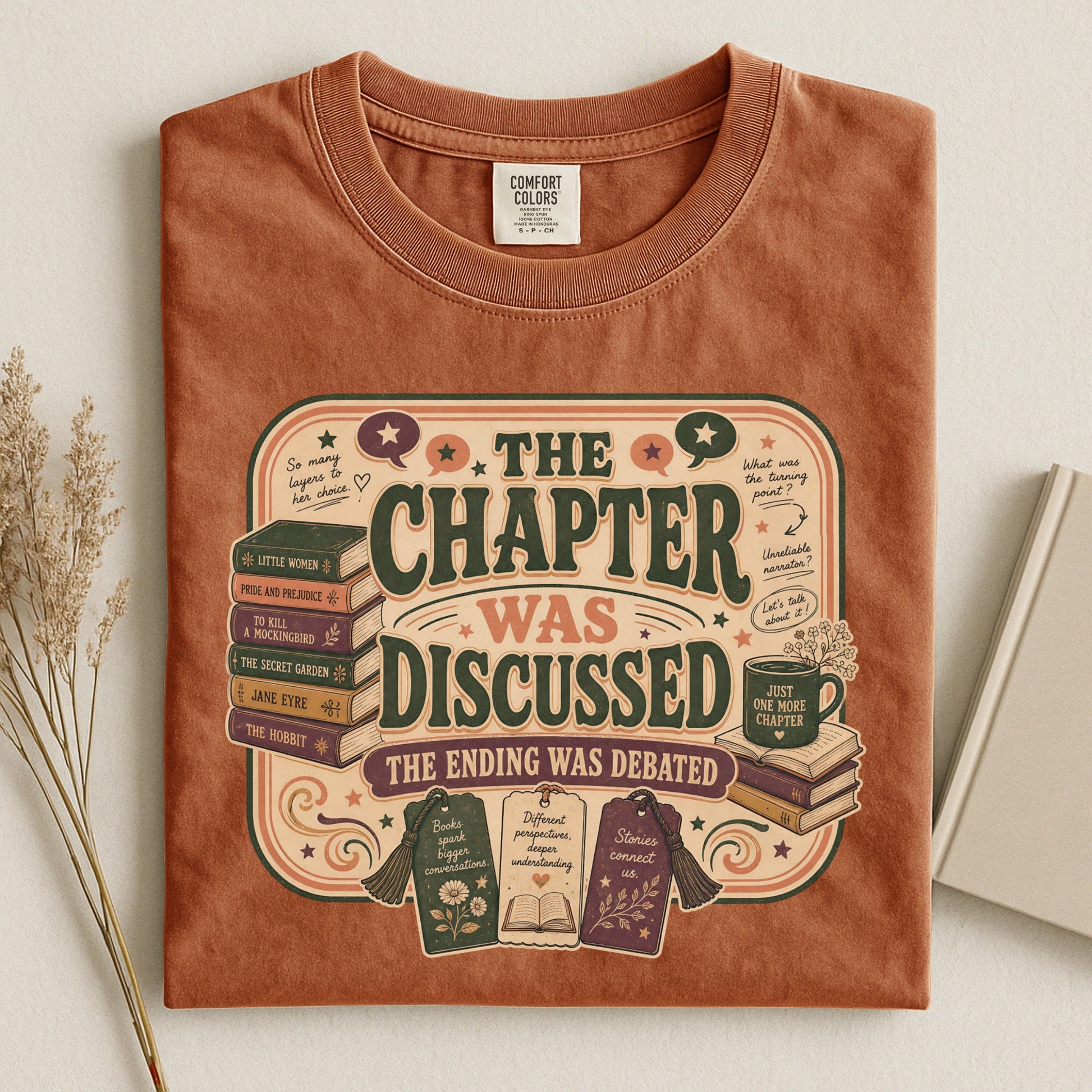 The Chapter Was Discussed bookish tee in Yam, flat lay