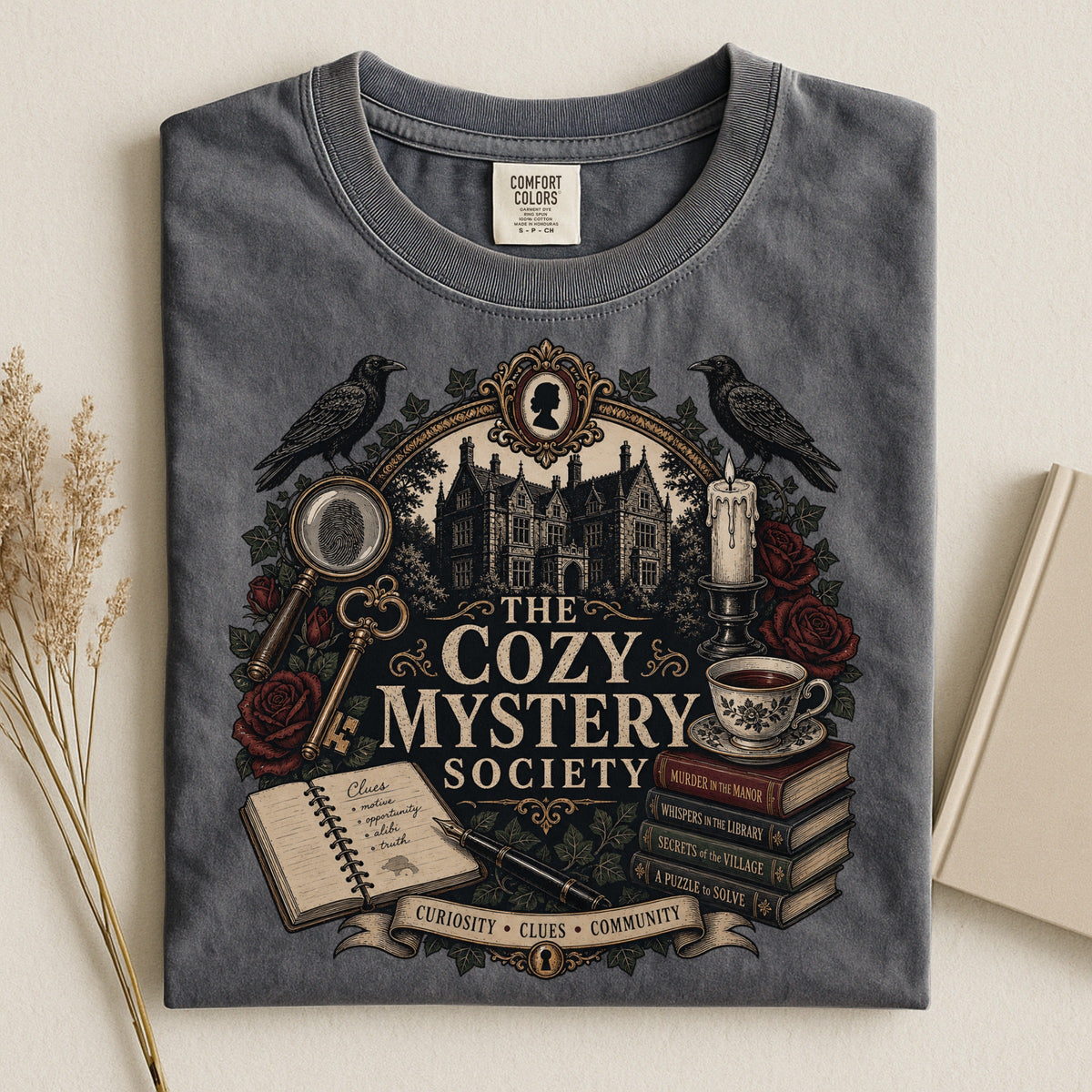 The Cozy Mystery Society bookish tee in Pepper, flat lay