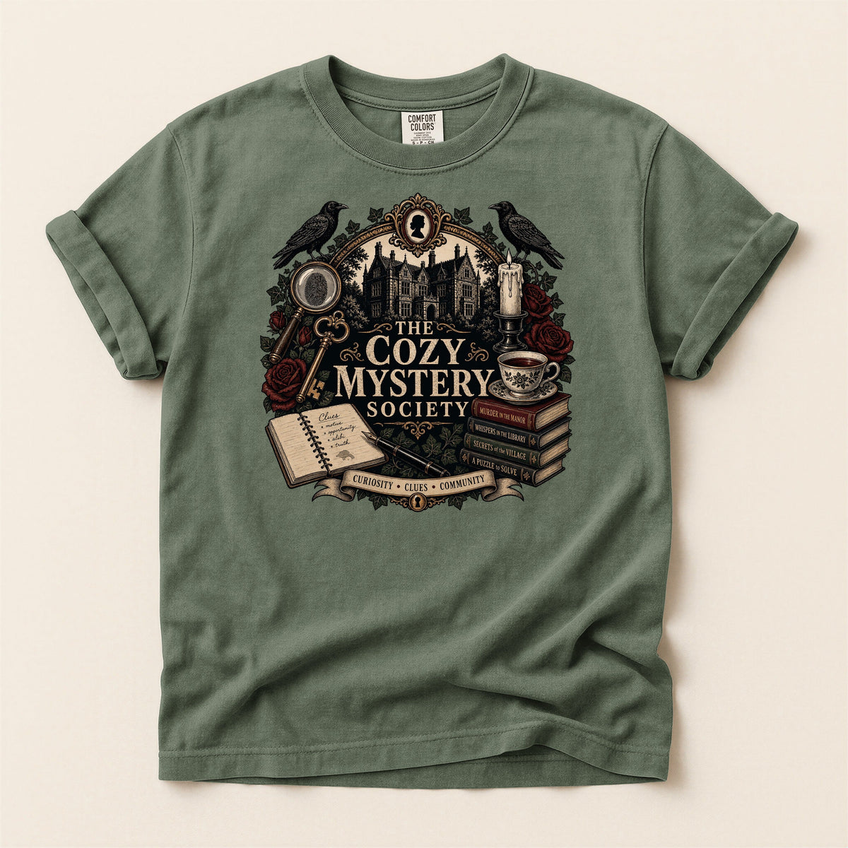 The Cozy Mystery Society bookish tee in Moss, full flat