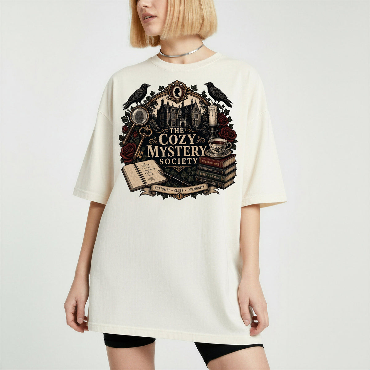 The Cozy Mystery Society bookish tee in Ivory, worn