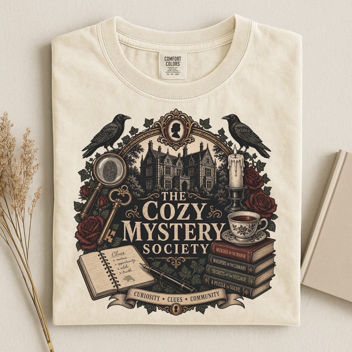 The Cozy Mystery Society bookish tee in Ivory, flat lay