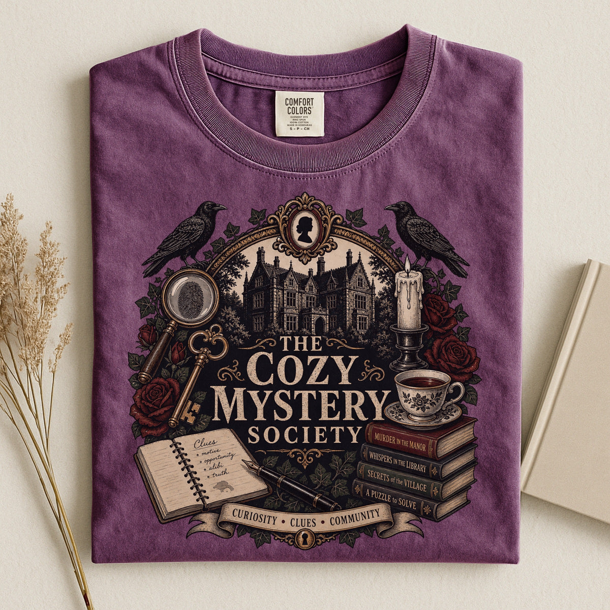 The Cozy Mystery Society bookish tee in Berry, flat lay