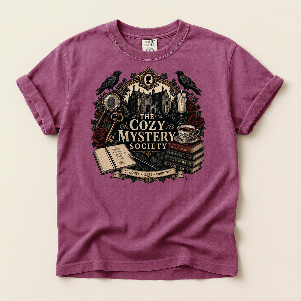 The Cozy Mystery Society bookish tee in Berry, full flat