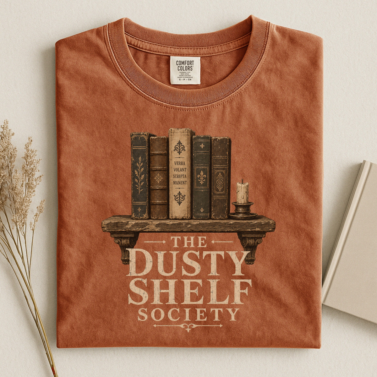 Shelf Love Studio The Dusty Shelf Society t-shirt in Yam, styled flat lay