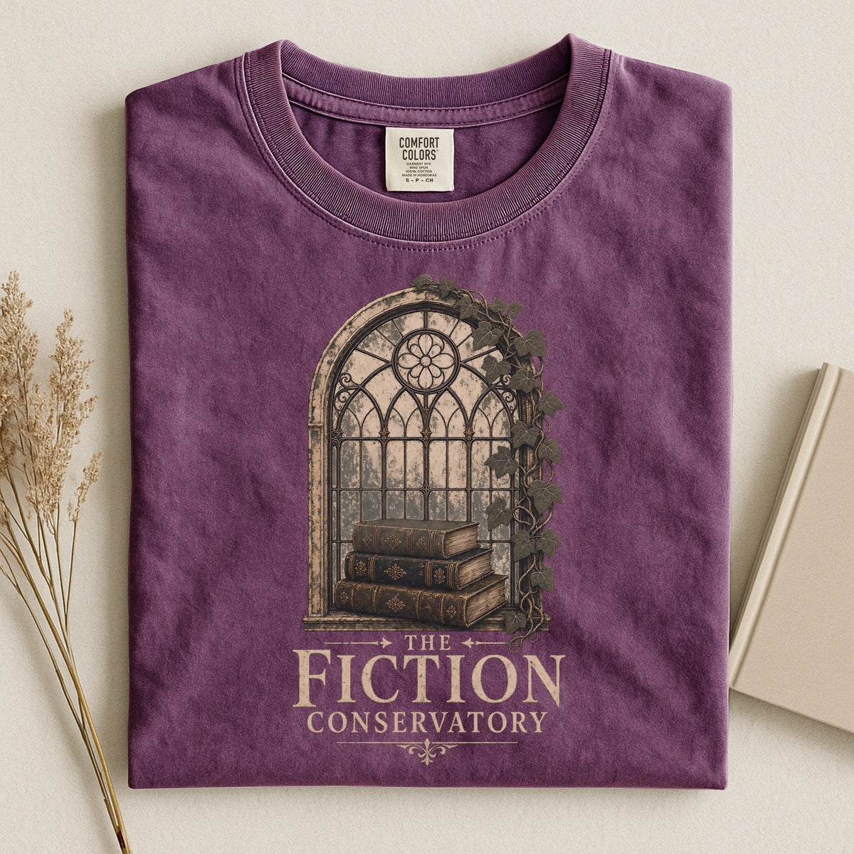 Shelf Love Studio The Fiction Conservatory t-shirt in Berry, styled flat lay