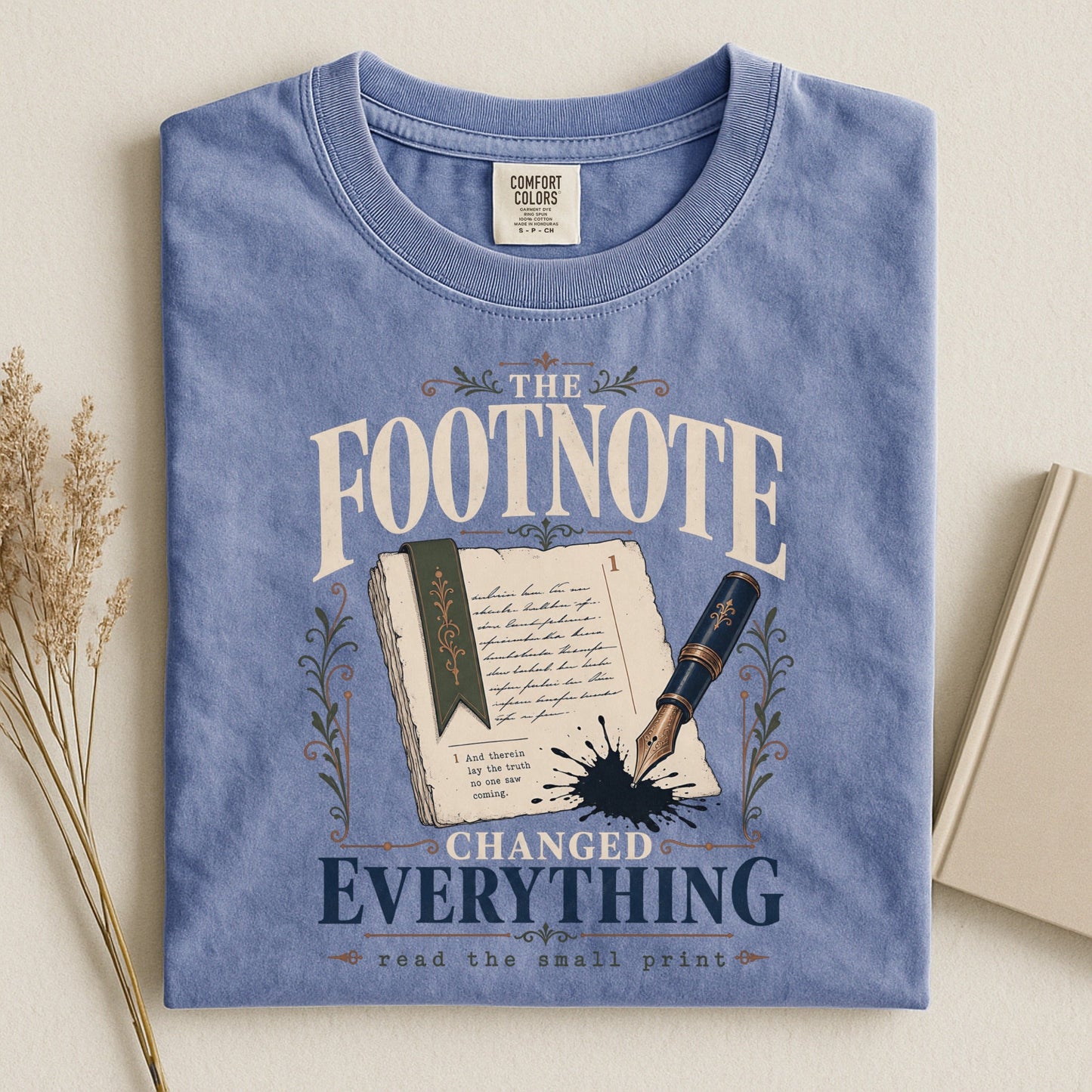 The Footnote Changed Everything bookish tee in Blue Jean, flat lay