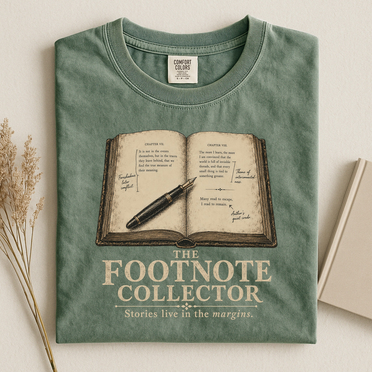 Shelf Love Studio The Footnote Collector t-shirt in Moss, styled flat lay