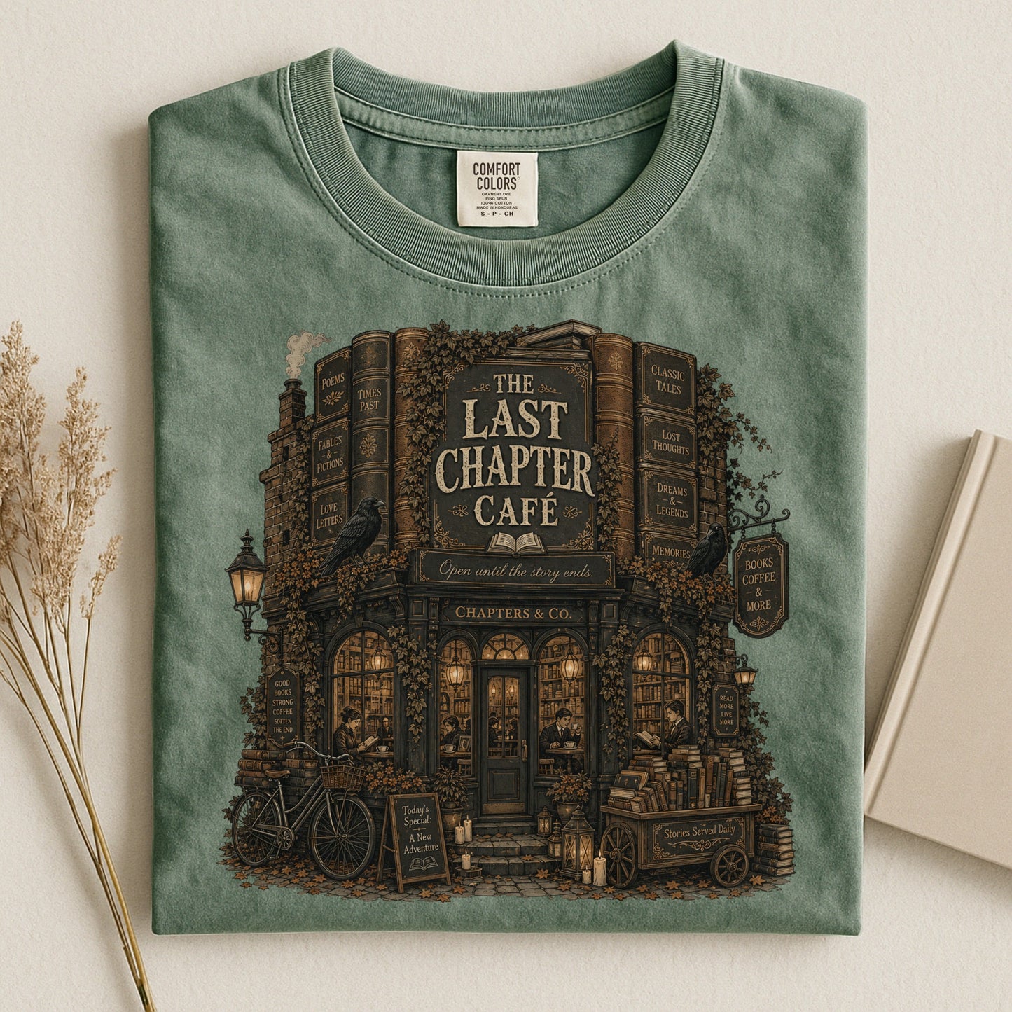 The Last Chapter Cafe bookish tee in Moss, flat lay