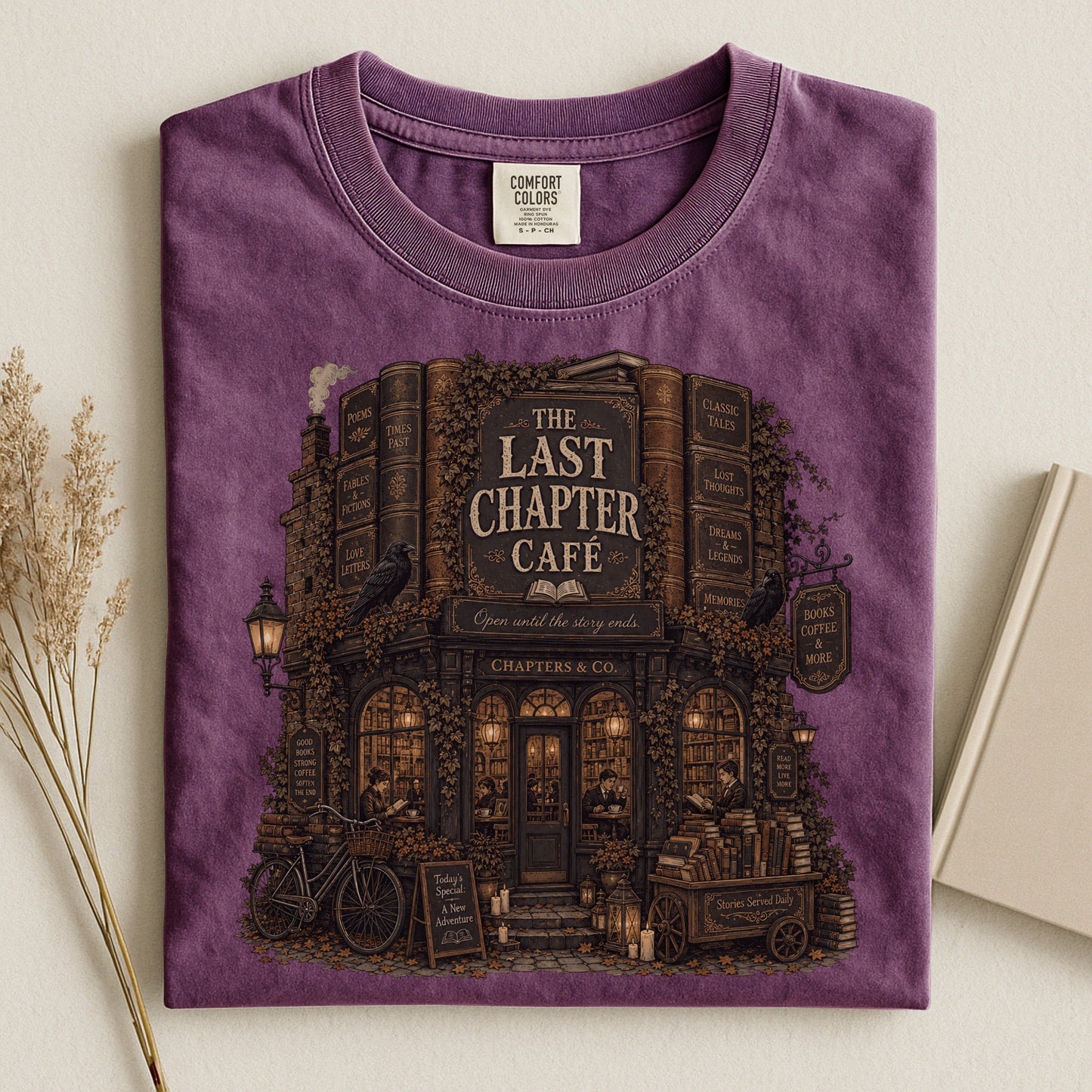 The Last Chapter Cafe bookish tee in Berry, flat lay