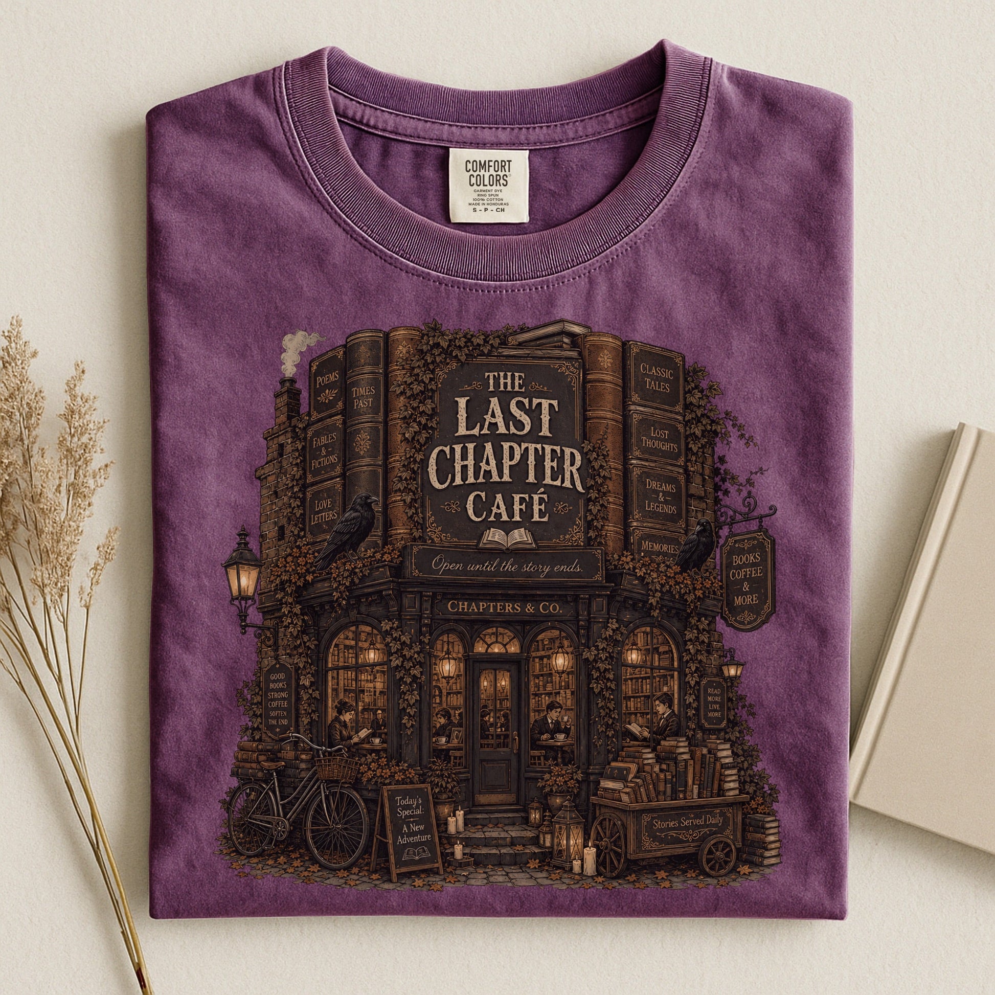The Last Chapter Cafe bookish tee in Berry, flat lay