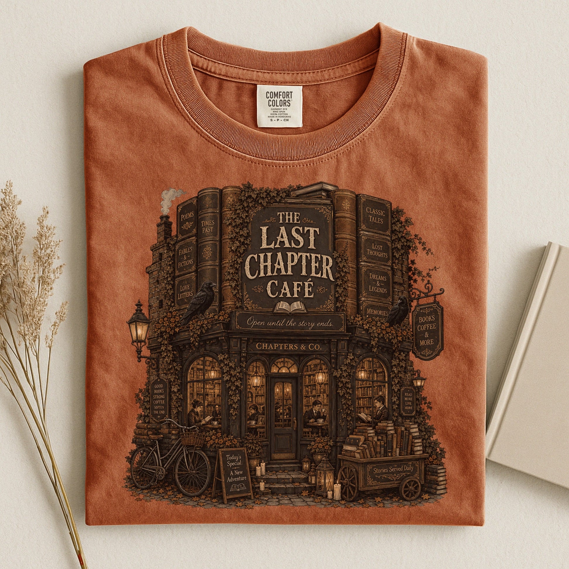 The Last Chapter Cafe bookish tee in Yam, flat lay