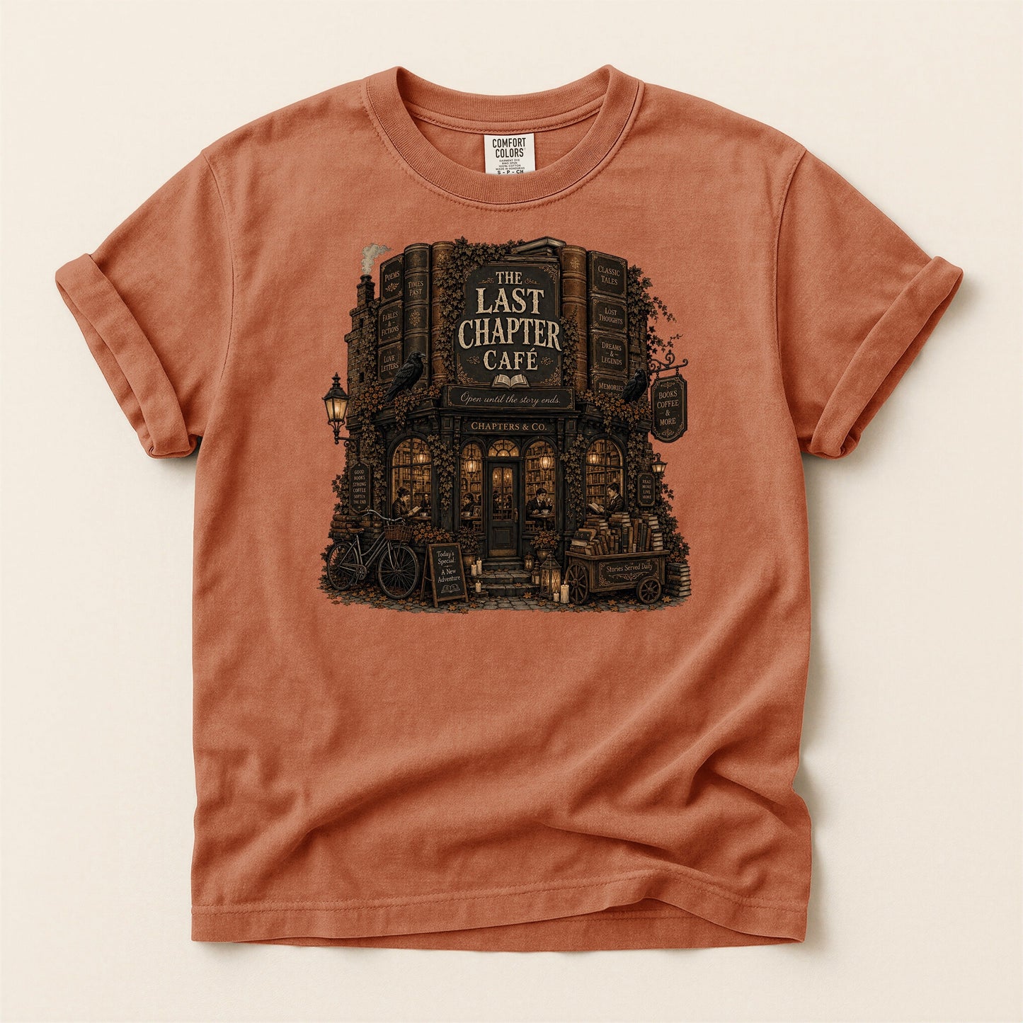 The Last Chapter Cafe bookish tee in Yam, full flat