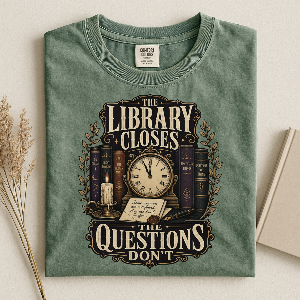 Shelf Love Studio The Library Closes t-shirt in Moss, styled flat lay