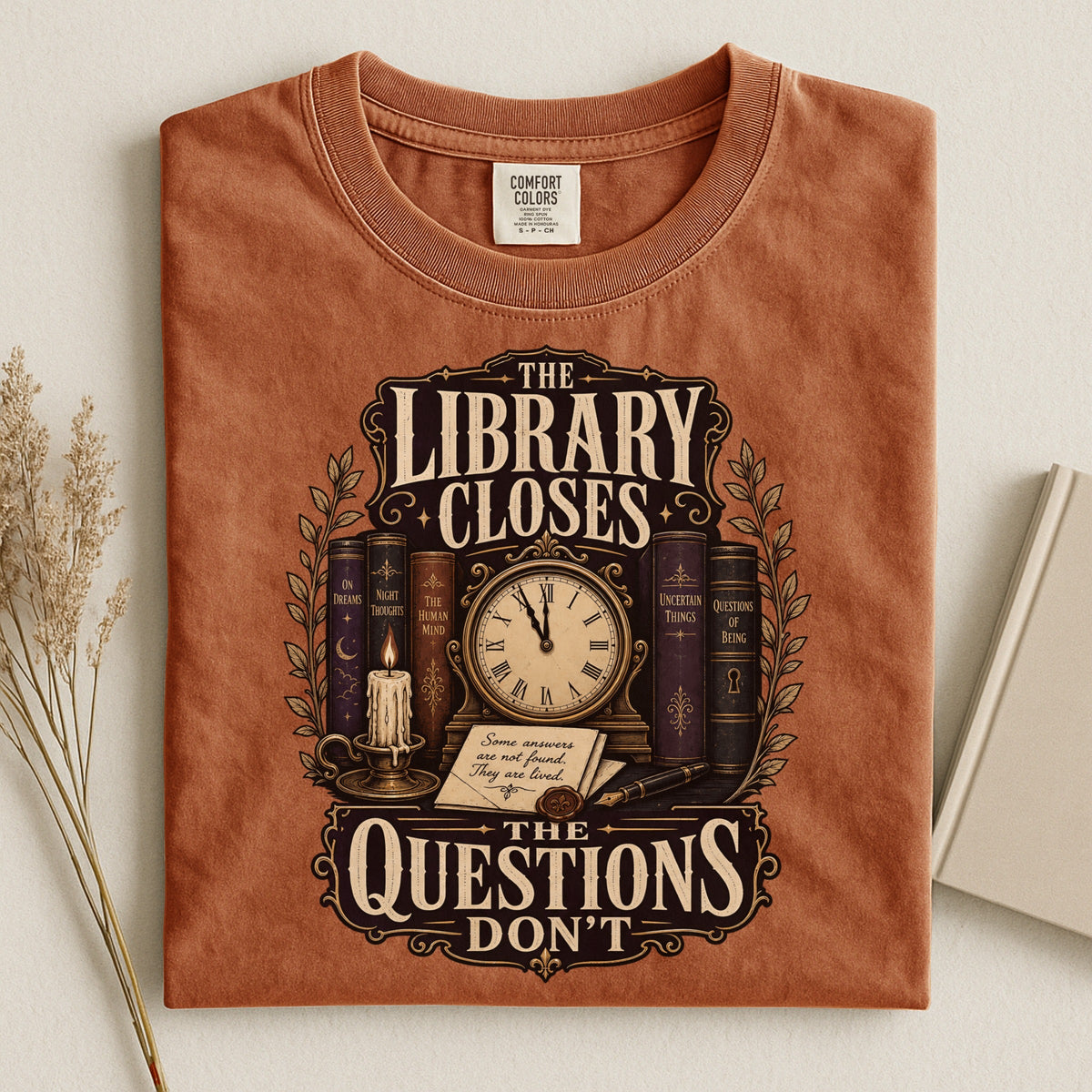 Shelf Love Studio The Library Closes t-shirt in Yam, styled flat lay