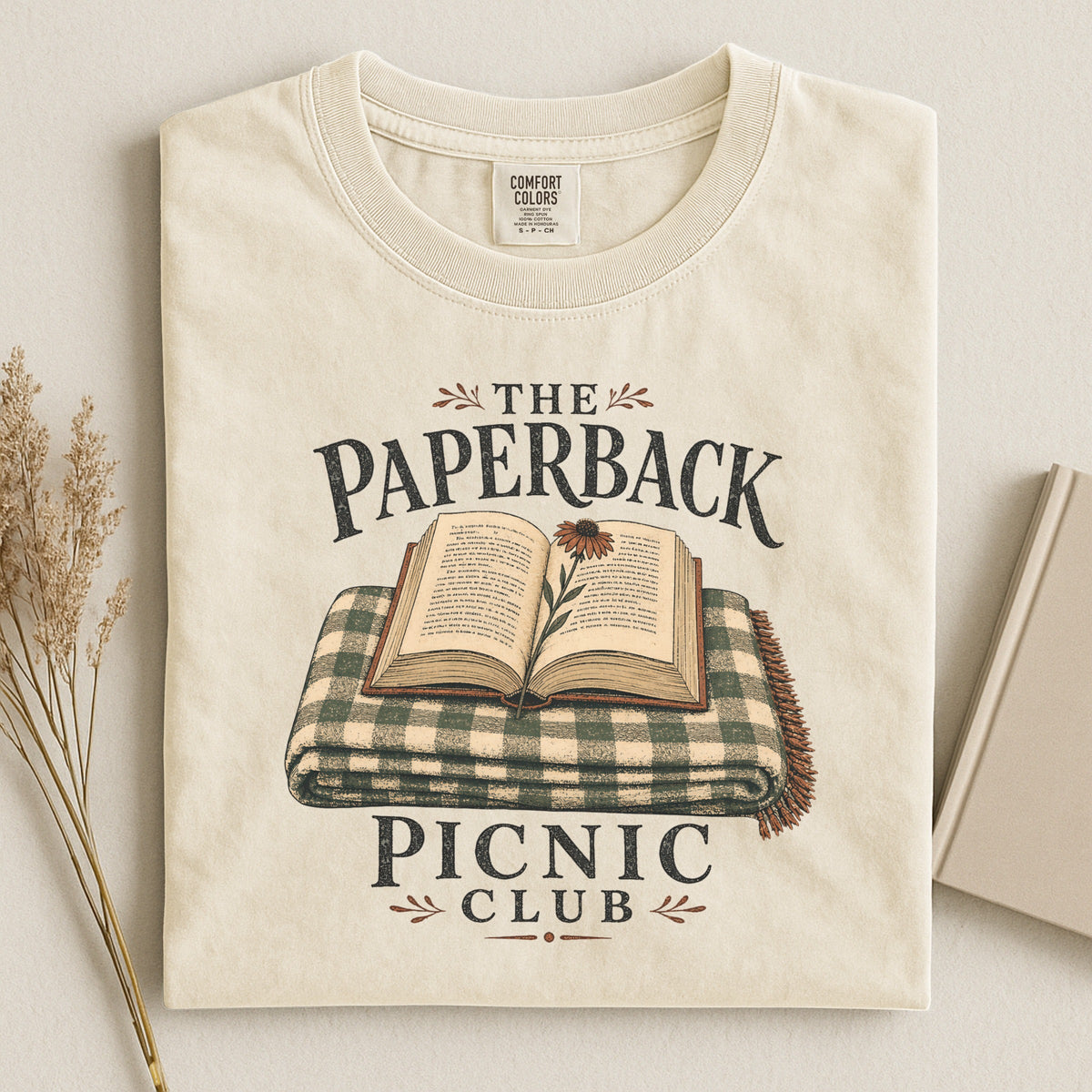 Shelf Love Studio The Paperback Picnic Club t-shirt in Ivory, styled flat lay