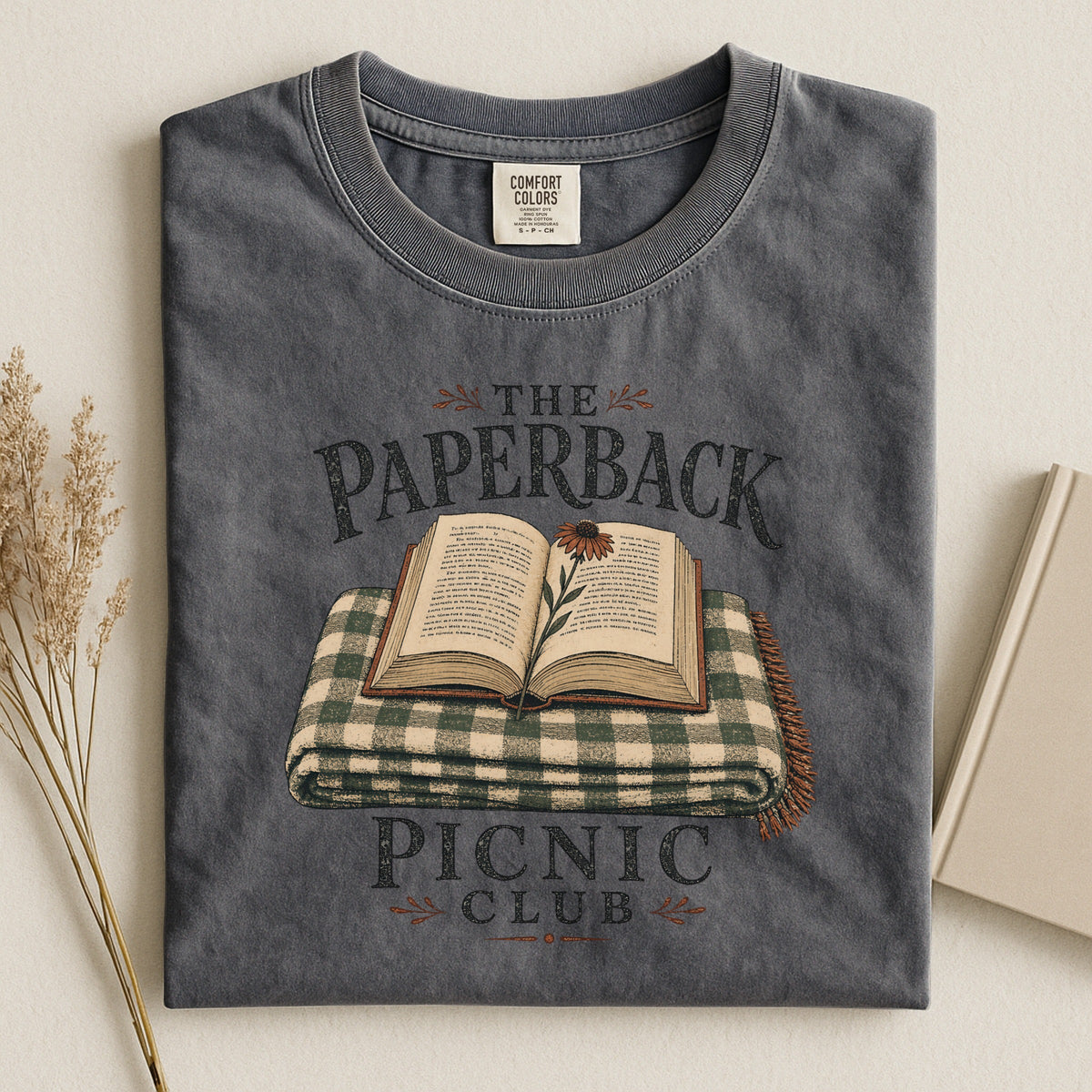 Shelf Love Studio The Paperback Picnic Club t-shirt in Pepper, styled flat lay