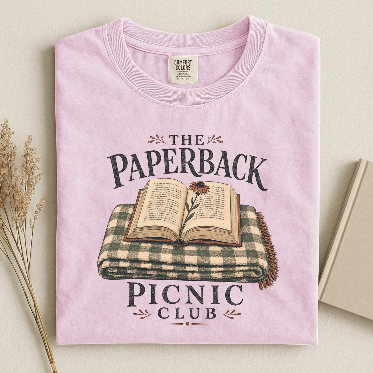 Shelf Love Studio The Paperback Picnic Club t-shirt in Blossom, styled flat lay