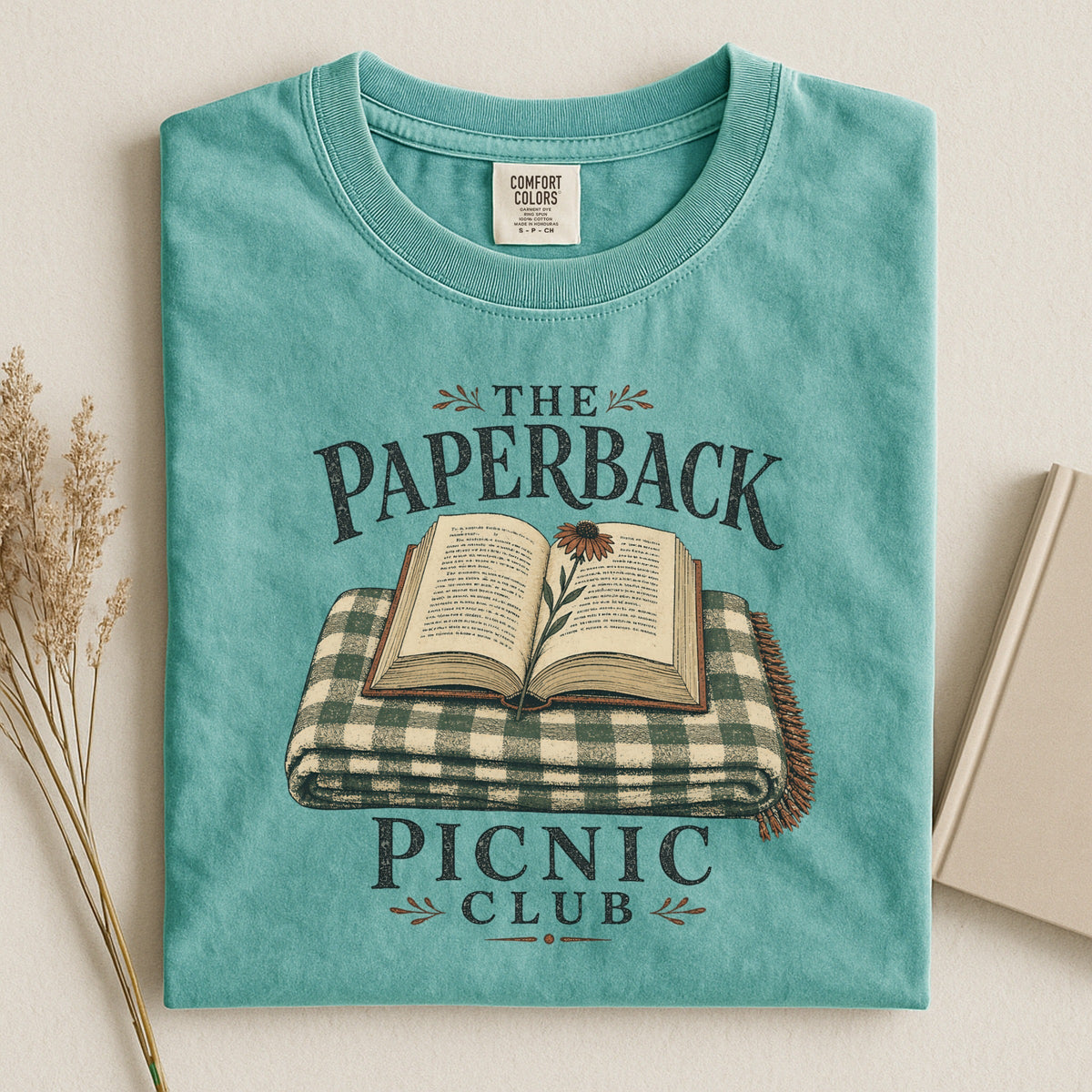 Shelf Love Studio The Paperback Picnic Club t-shirt in Seafoam, styled flat lay