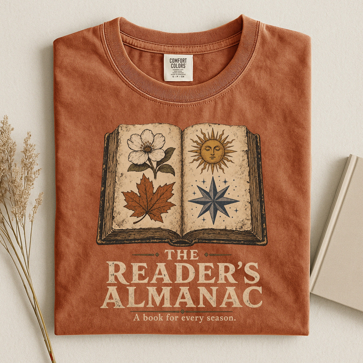 Shelf Love Studio The Reader's Almanac t-shirt in Yam, styled flat lay
