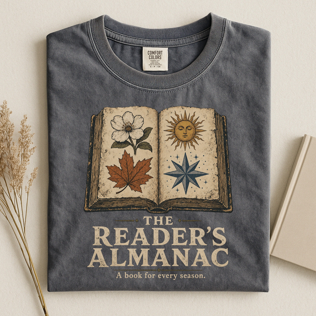 Shelf Love Studio The Reader's Almanac t-shirt in Pepper, styled flat lay