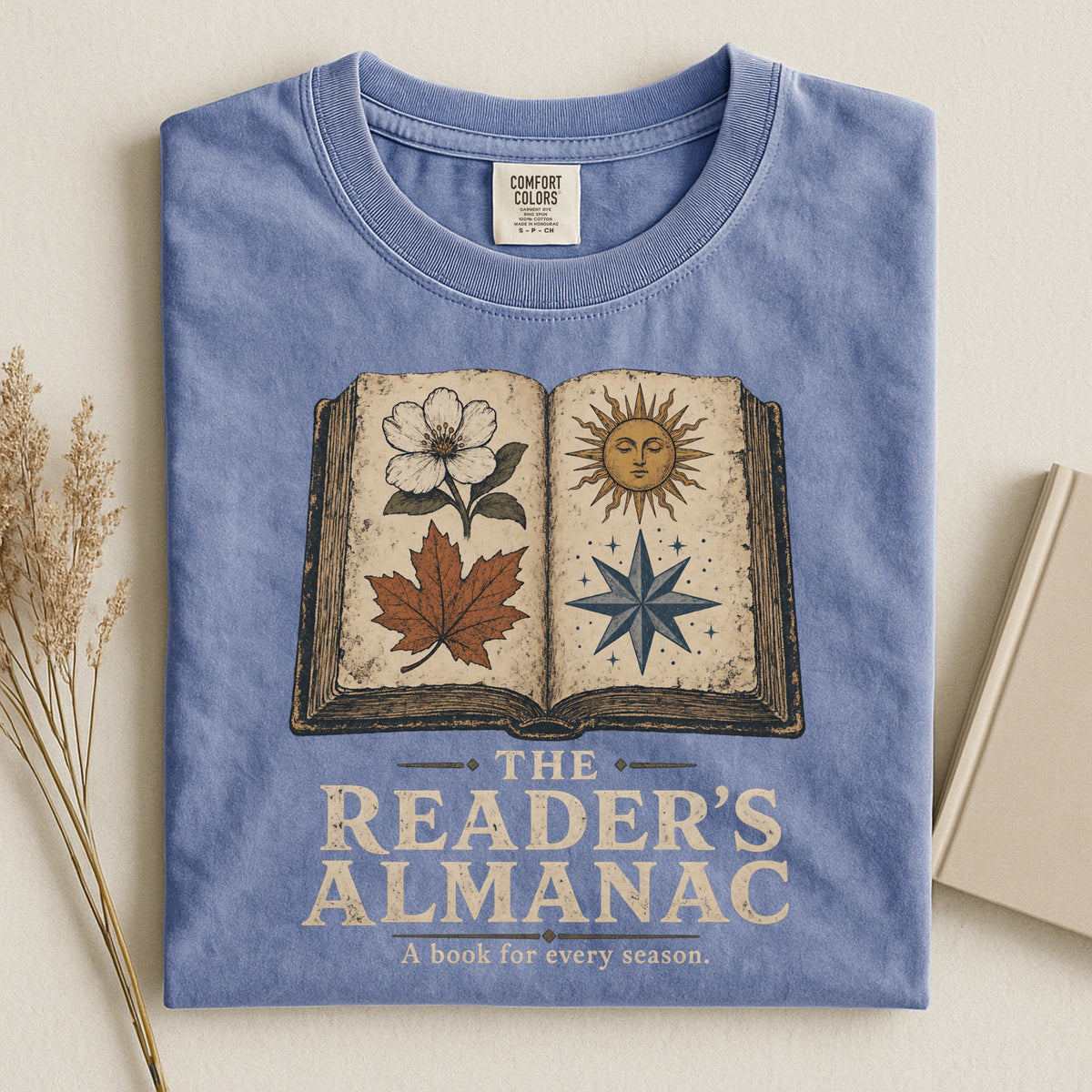 Shelf Love Studio The Reader's Almanac t-shirt in Blue Jean, styled flat lay